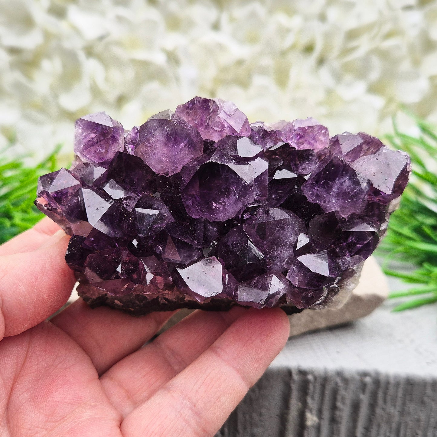 A grade Brazilian Amethyst cluster with deep purple points. A calming crystal for peaceful home spaces, bedrooms, and thoughtful crystal gifts.