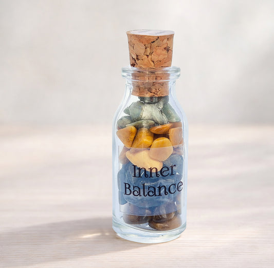 Inner Balance crystal bottle with jade, tiger eye, moss agate and jasper. A grounding decorative blend for calm focus, steady confidence and thoughtful gifting.
