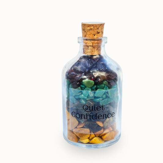 Quiet Confidence crystal blend bottle with garnet, jasper, amazonite and labradorite. A grounding decorative piece for calm self-assurance and composed communication.