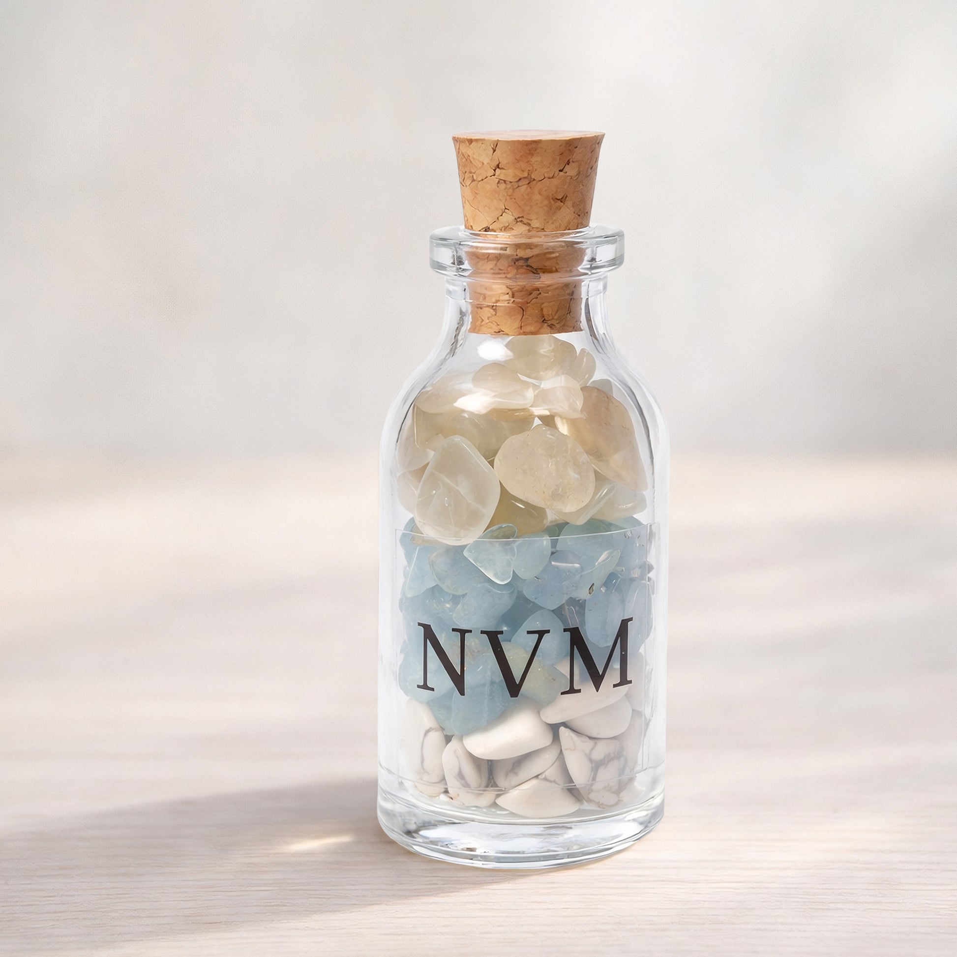 NVM Never Mind crystal blend bottle with howlite, aquamarine and moonstone. A decorative grounding piece for letting go, emotional reset and calm detachment.