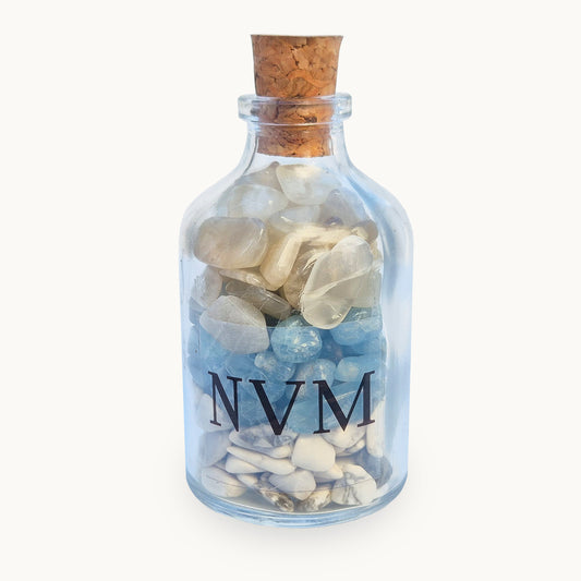 NVM Never Mind crystal blend bottle with howlite, aquamarine and moonstone. A decorative grounding piece for letting go, emotional reset and calm detachment.