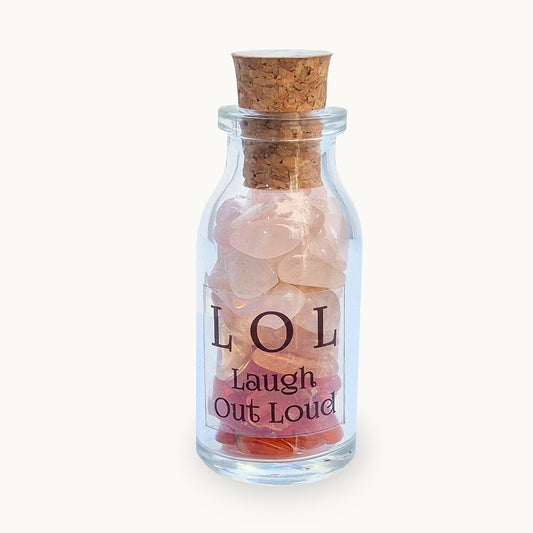 LOL Laugh Out Loud crystal blend bottle with citrine, carnelian and rose quartz. A decorative uplifting piece for brighter moments, warmth and a cheerful atmosphere.