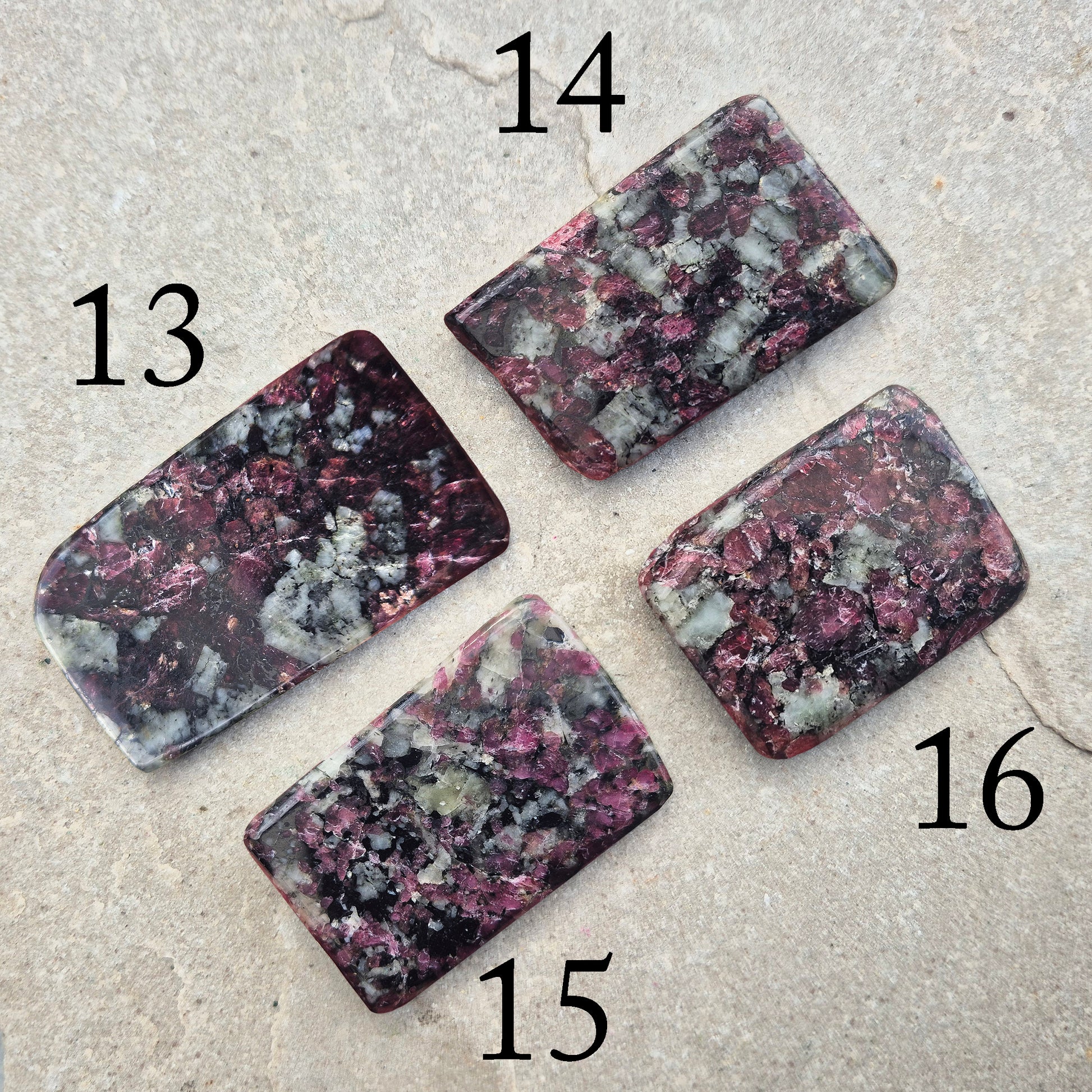 Polished Eudialyte flat stone from Greenland with rich red and pink tones. Associated with emotional steadiness, heart support, and grounded change.
