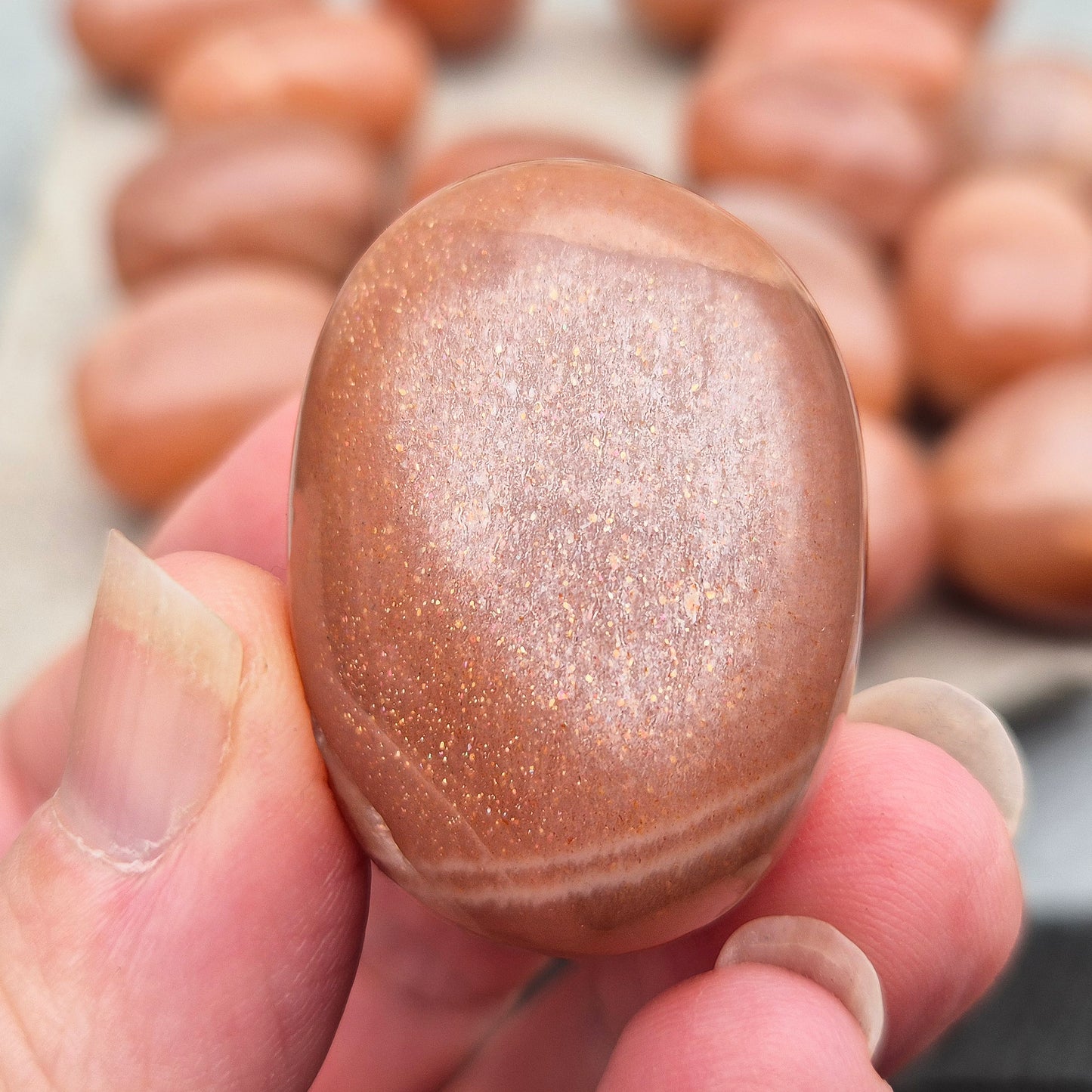 Golden Feldspar XL tumble stone with warm golden colour and natural sparkle. A crystal associated with optimism, creativity, and personal confidence.
