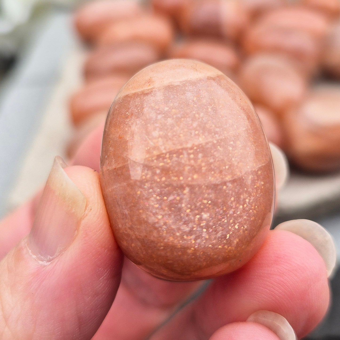 Golden Feldspar XL tumble stone with warm golden colour and natural sparkle. A crystal associated with optimism, creativity, and personal confidence.