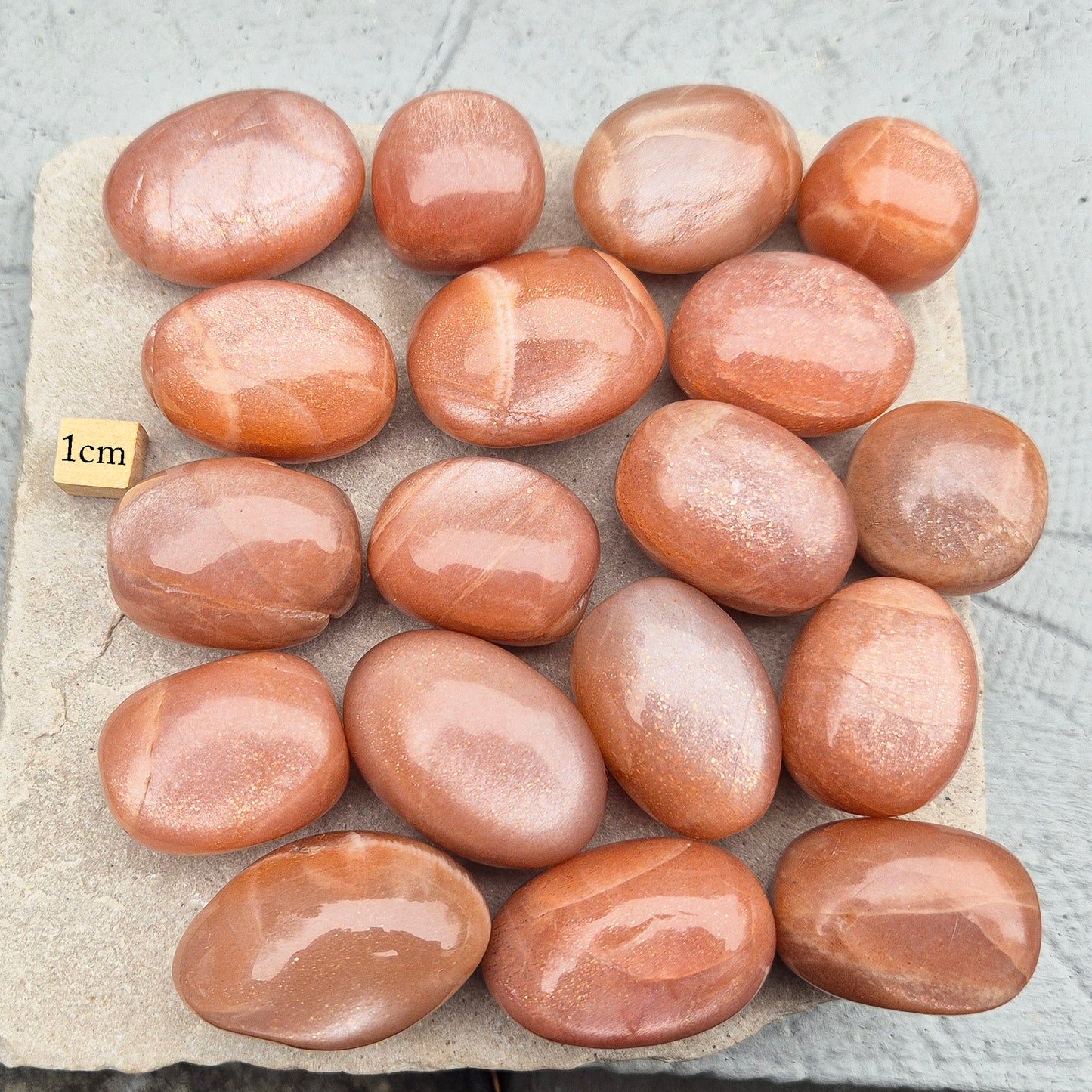 Golden Feldspar XL tumble stone with warm golden colour and natural sparkle. A crystal associated with optimism, creativity, and personal confidence.