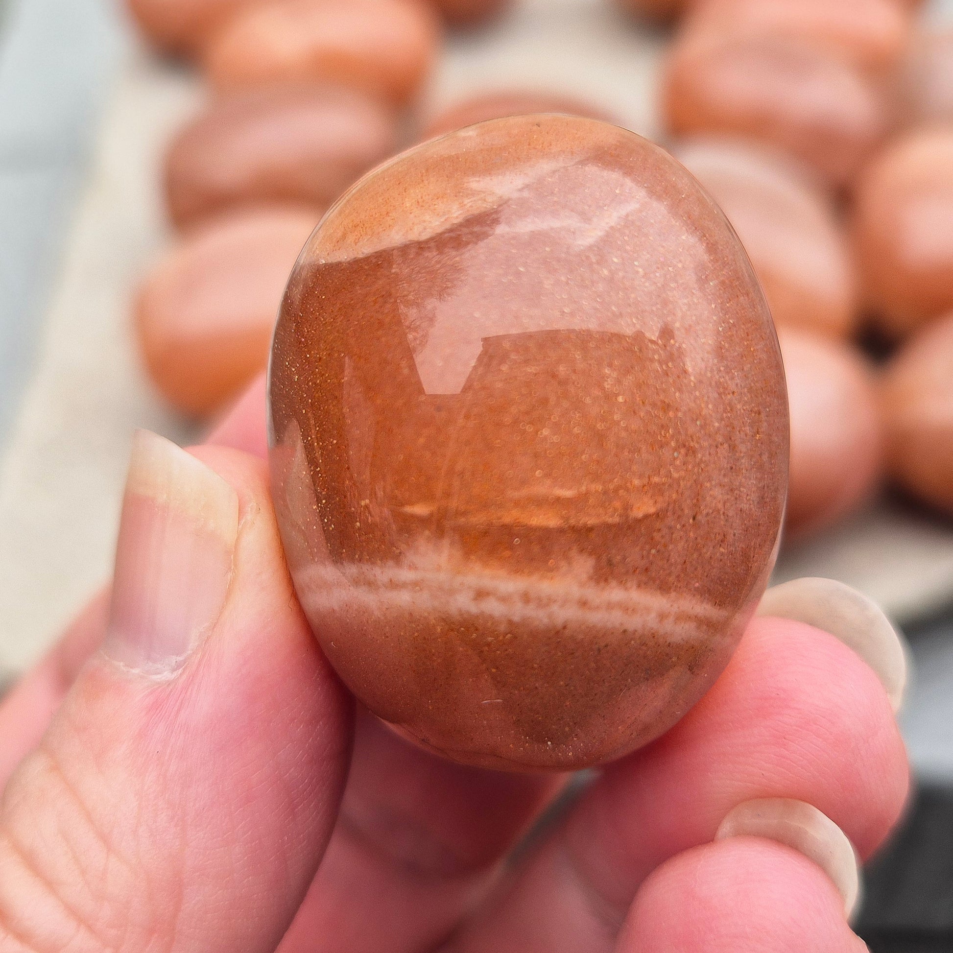 Golden Feldspar XL tumble stone with warm golden colour and natural sparkle. A crystal associated with optimism, creativity, and personal confidence.