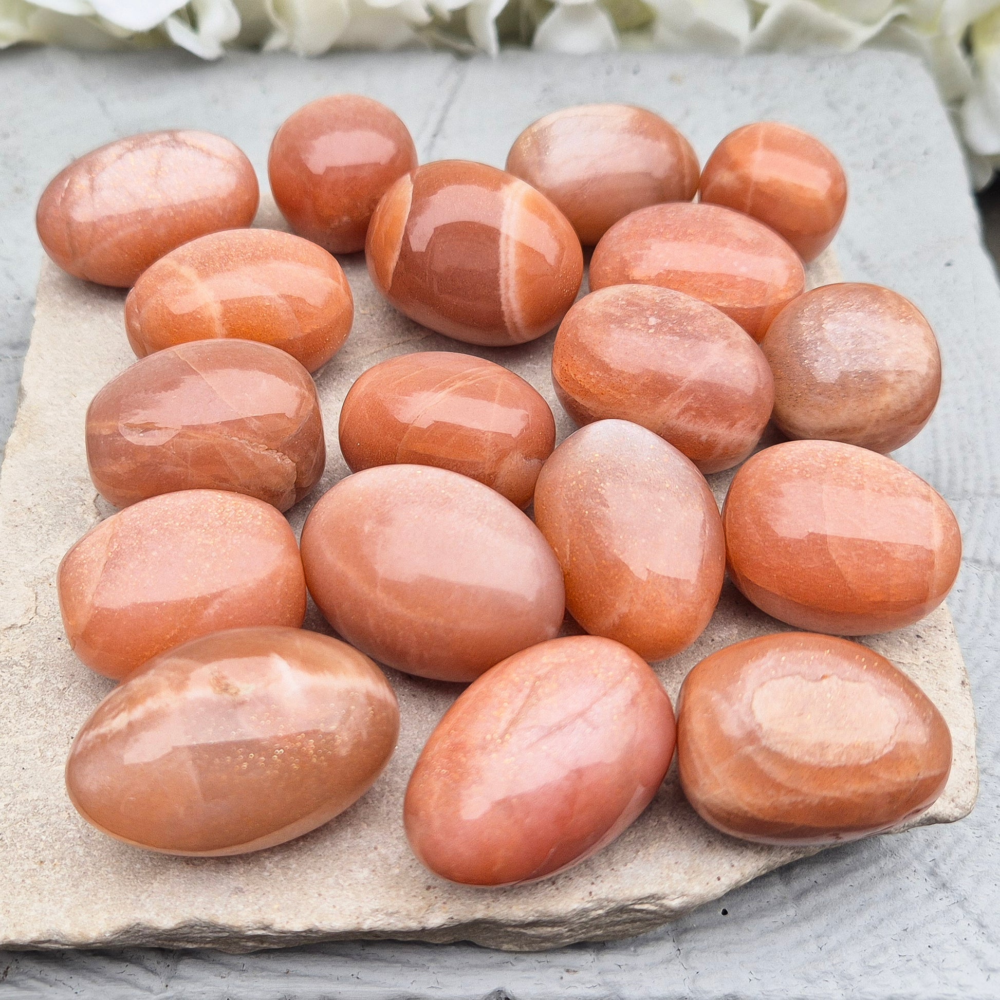 Golden Feldspar XL tumble stone with warm golden colour and natural sparkle. A crystal associated with optimism, creativity, and personal confidence.