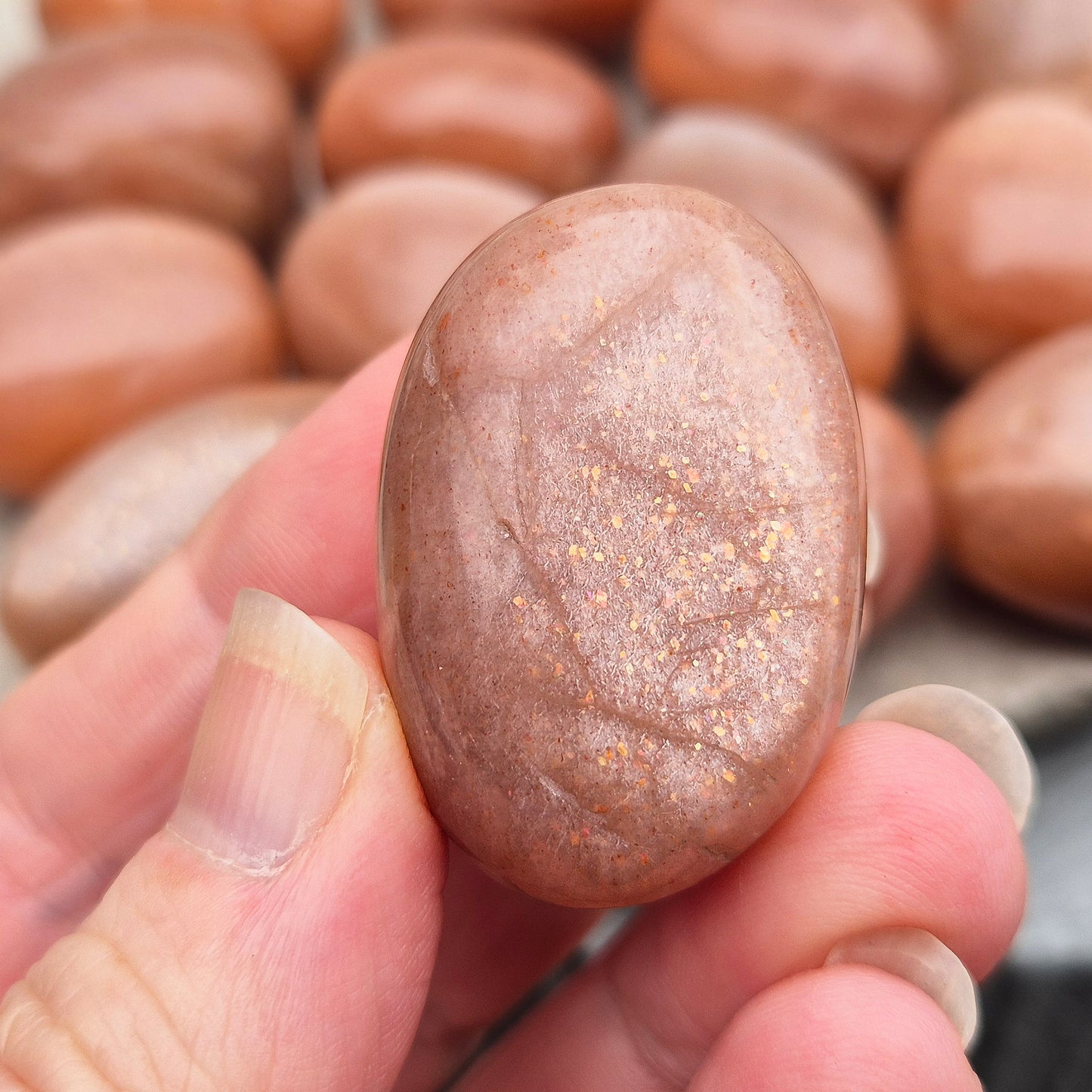 Golden Feldspar XL tumble stone with warm golden colour and natural sparkle. A crystal associated with optimism, creativity, and personal confidence.