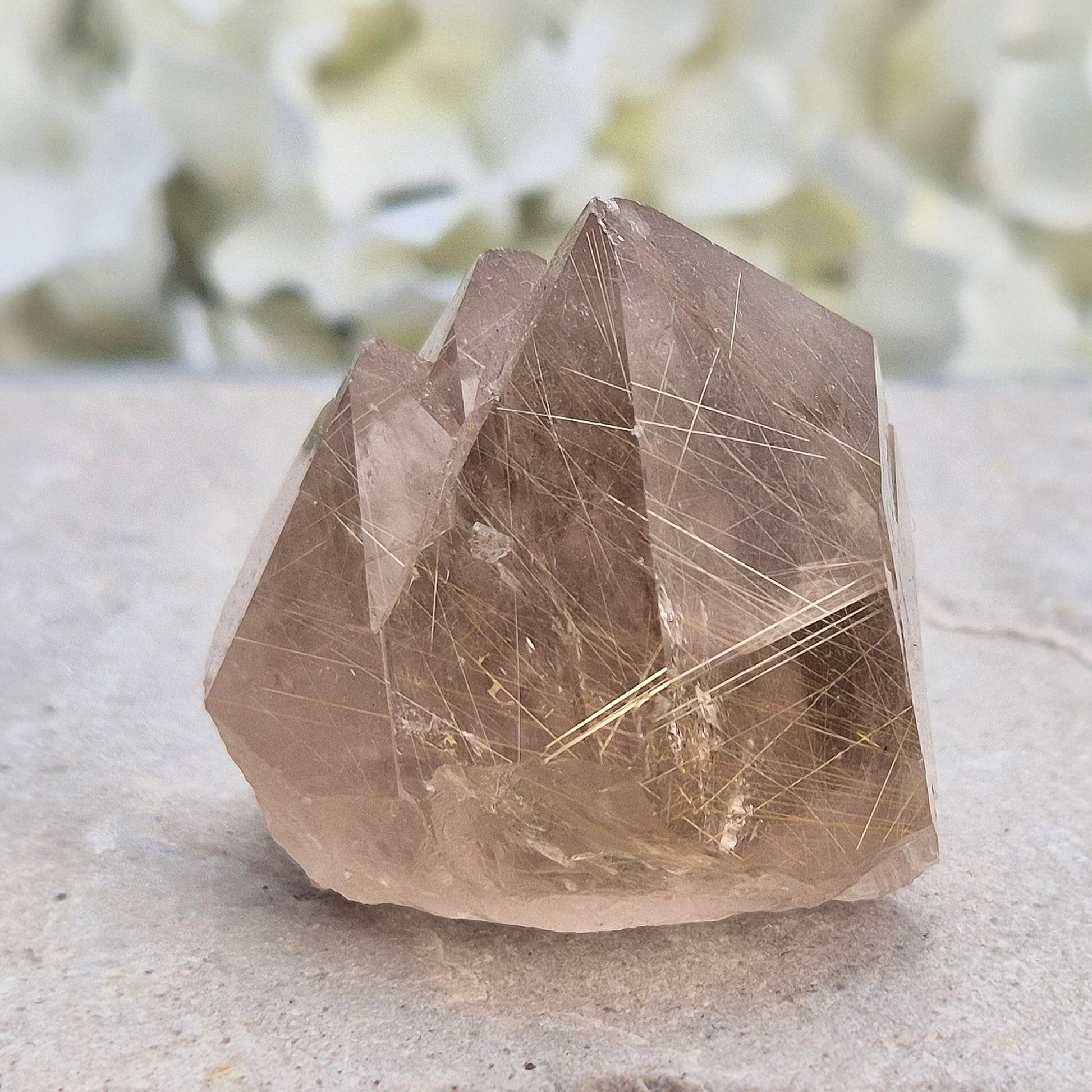Golden Rutilated Quartz multi-point crystal from Brazil featuring fine golden rutile needles. A striking natural specimen associated with focus, motivation, and fresh ideas.