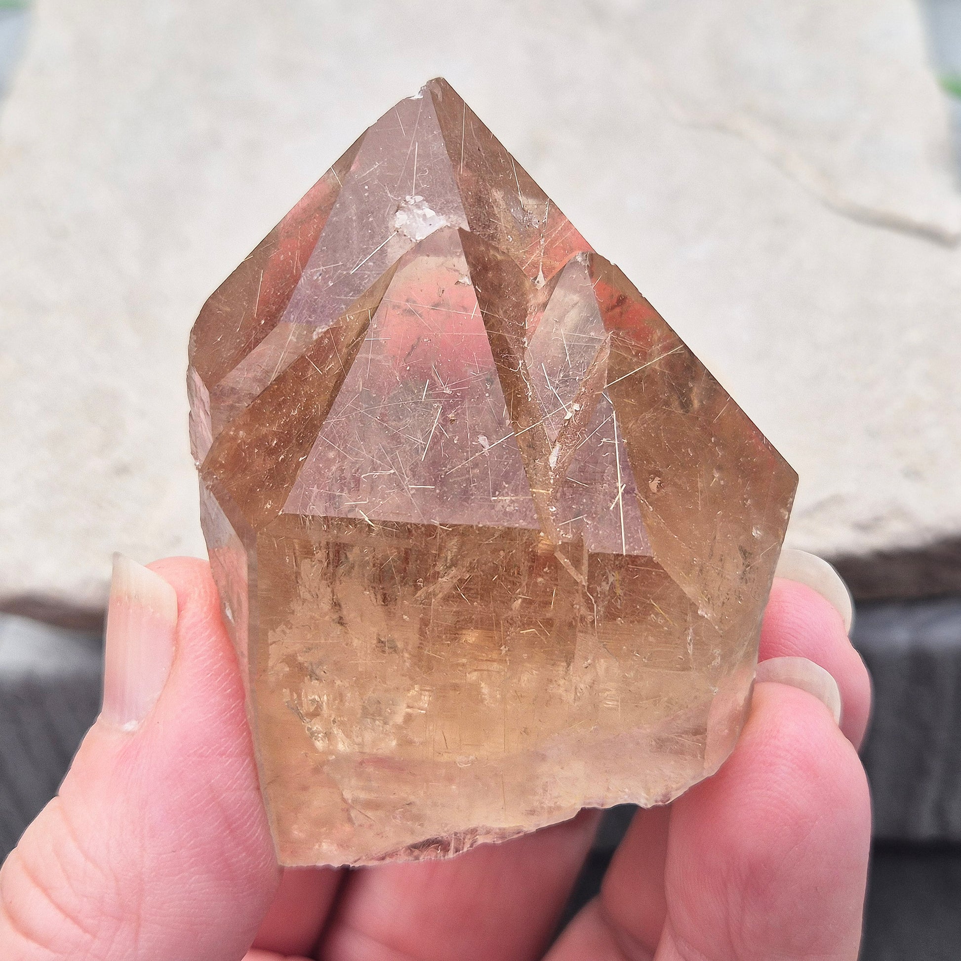 Golden Rutilated Quartz multi-point crystal from Brazil featuring fine golden rutile needles. A striking natural specimen associated with focus, motivation, and fresh ideas.