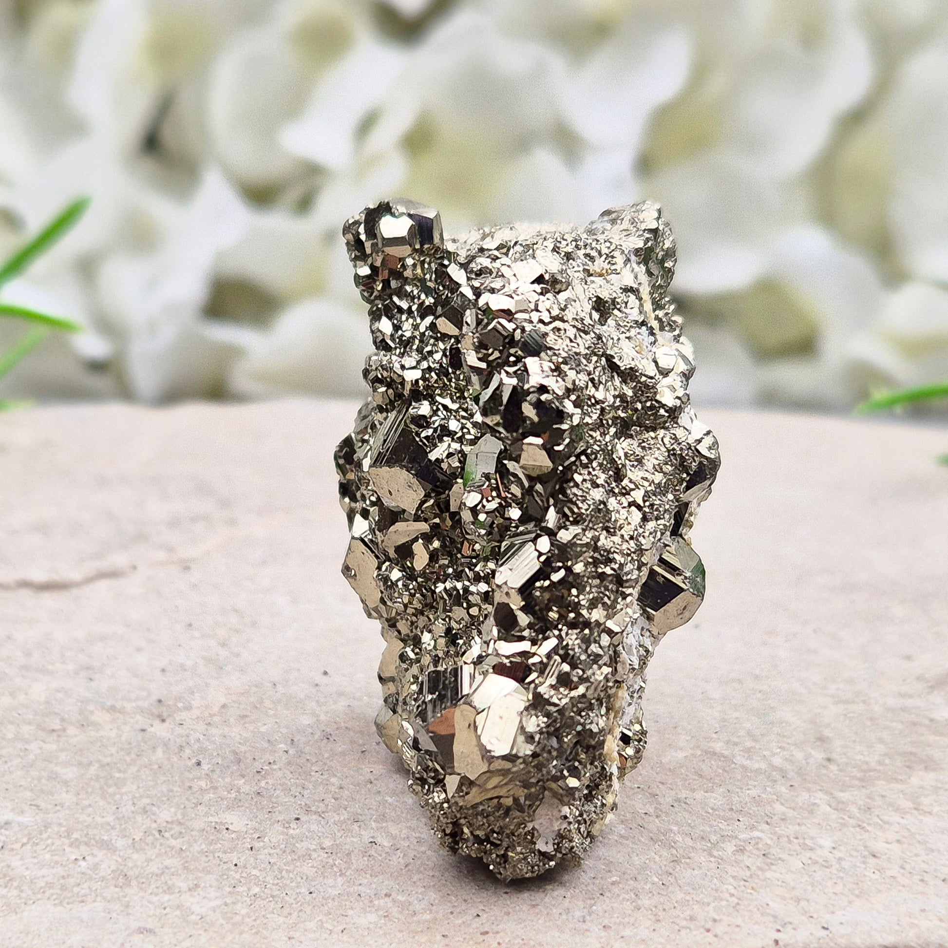 Natural pyrite crystal cluster from Peru featuring defined cubes and rich gold lustre. A striking, light-catching piece for home decor, desks, or crystal lovers.
