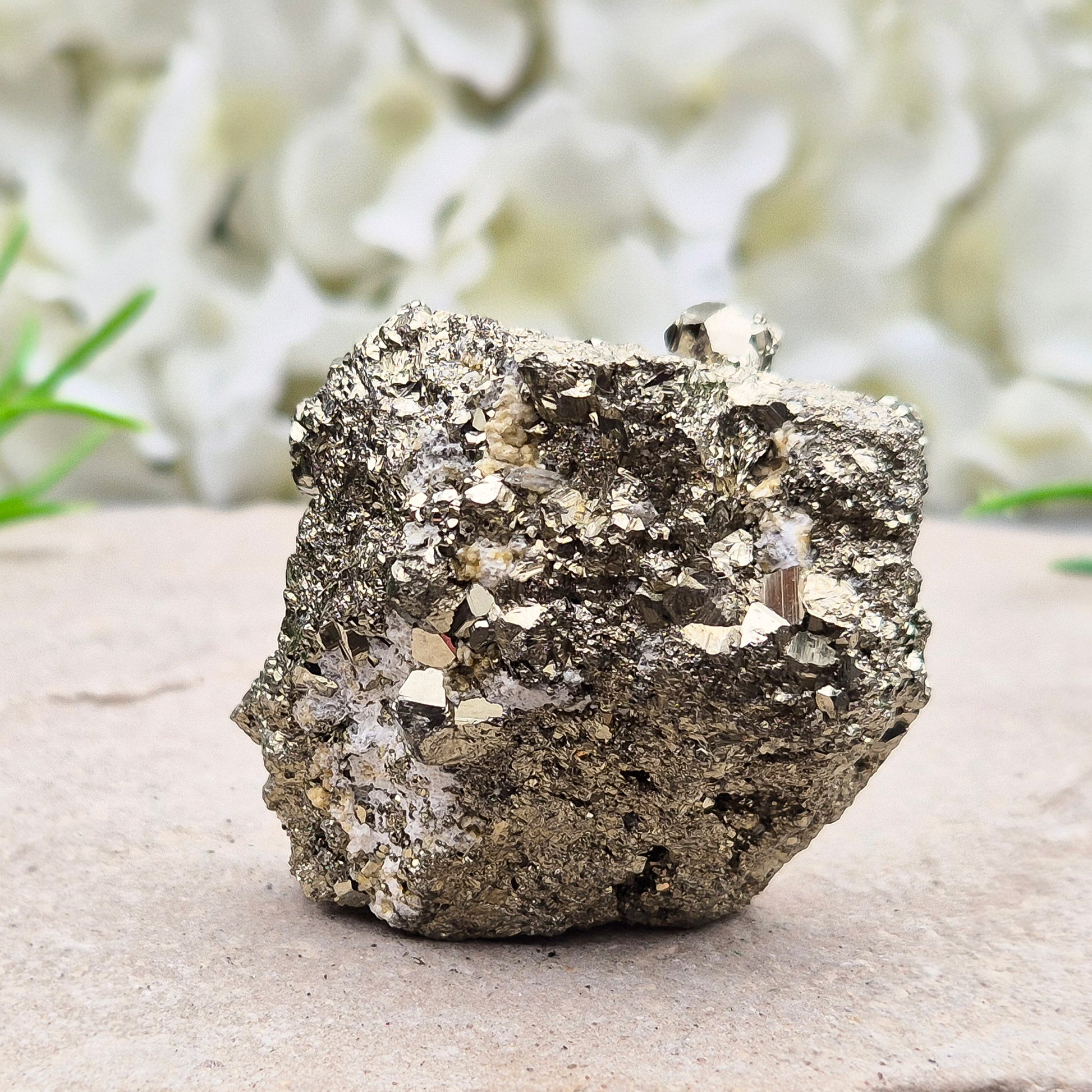 Natural pyrite crystal cluster from Peru featuring defined cubes and rich gold lustre. A striking, light-catching piece for home decor, desks, or crystal lovers.