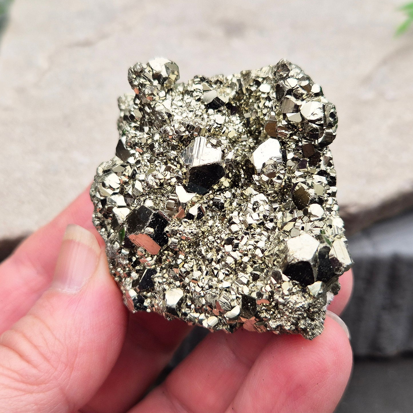 Natural pyrite crystal cluster from Peru featuring defined cubes and rich gold lustre. A striking, light-catching piece for home decor, desks, or crystal lovers.