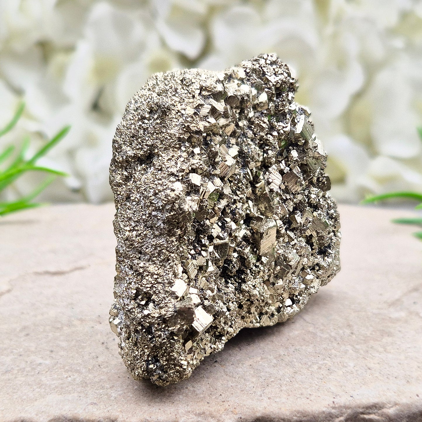 Peruvian pyrite cluster with natural cubic crystals and bright metallic shine. Sparkling druzy texture, ideal for display, grounding energy, or crystal collections.