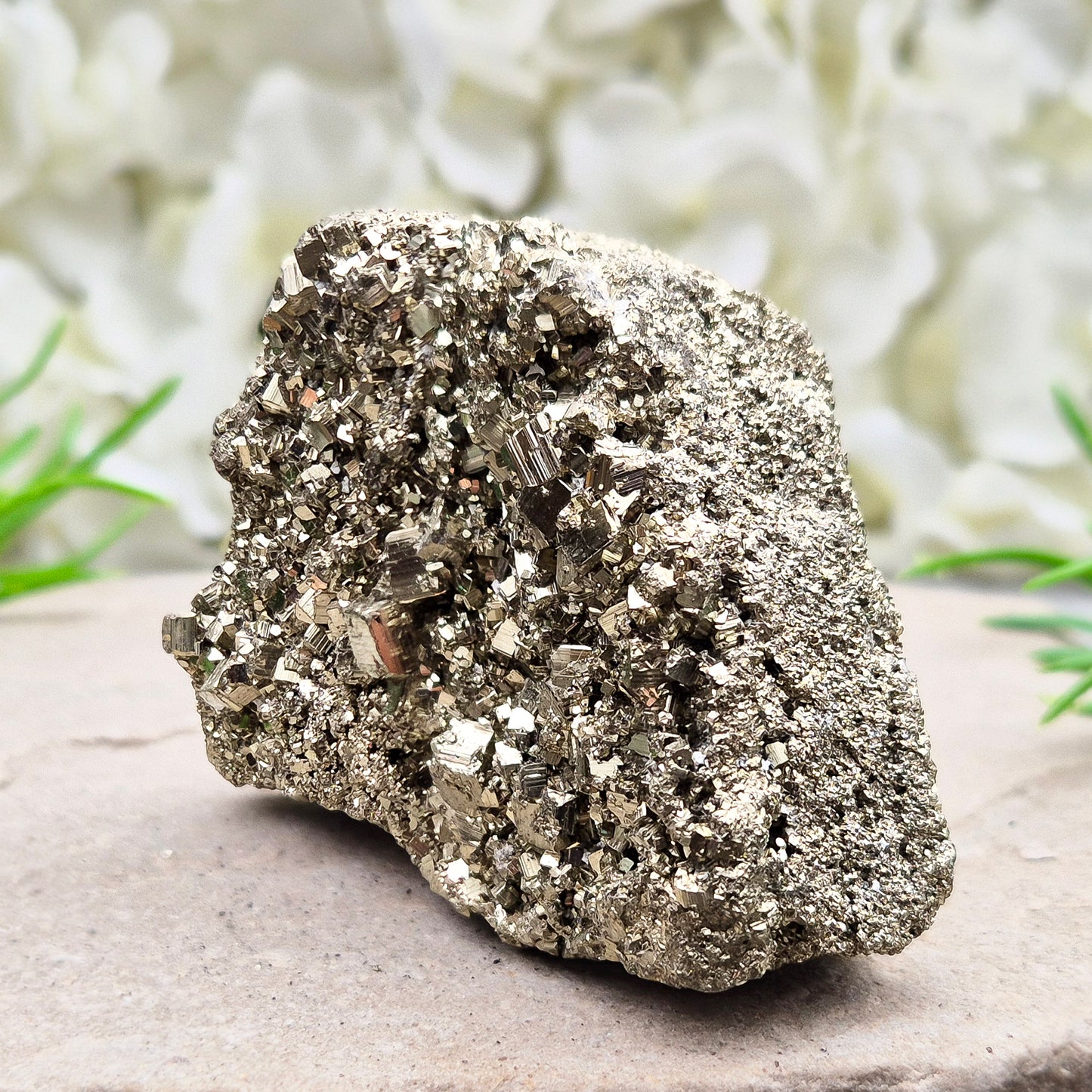 Peruvian pyrite cluster with natural cubic crystals and bright metallic shine. Sparkling druzy texture, ideal for display, grounding energy, or crystal collections.
