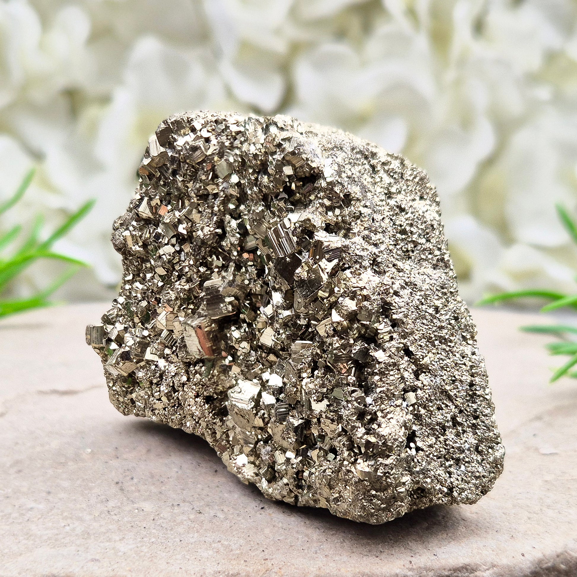 Peruvian pyrite cluster with natural cubic crystals and bright metallic shine. Sparkling druzy texture, ideal for display, grounding energy, or crystal collections.