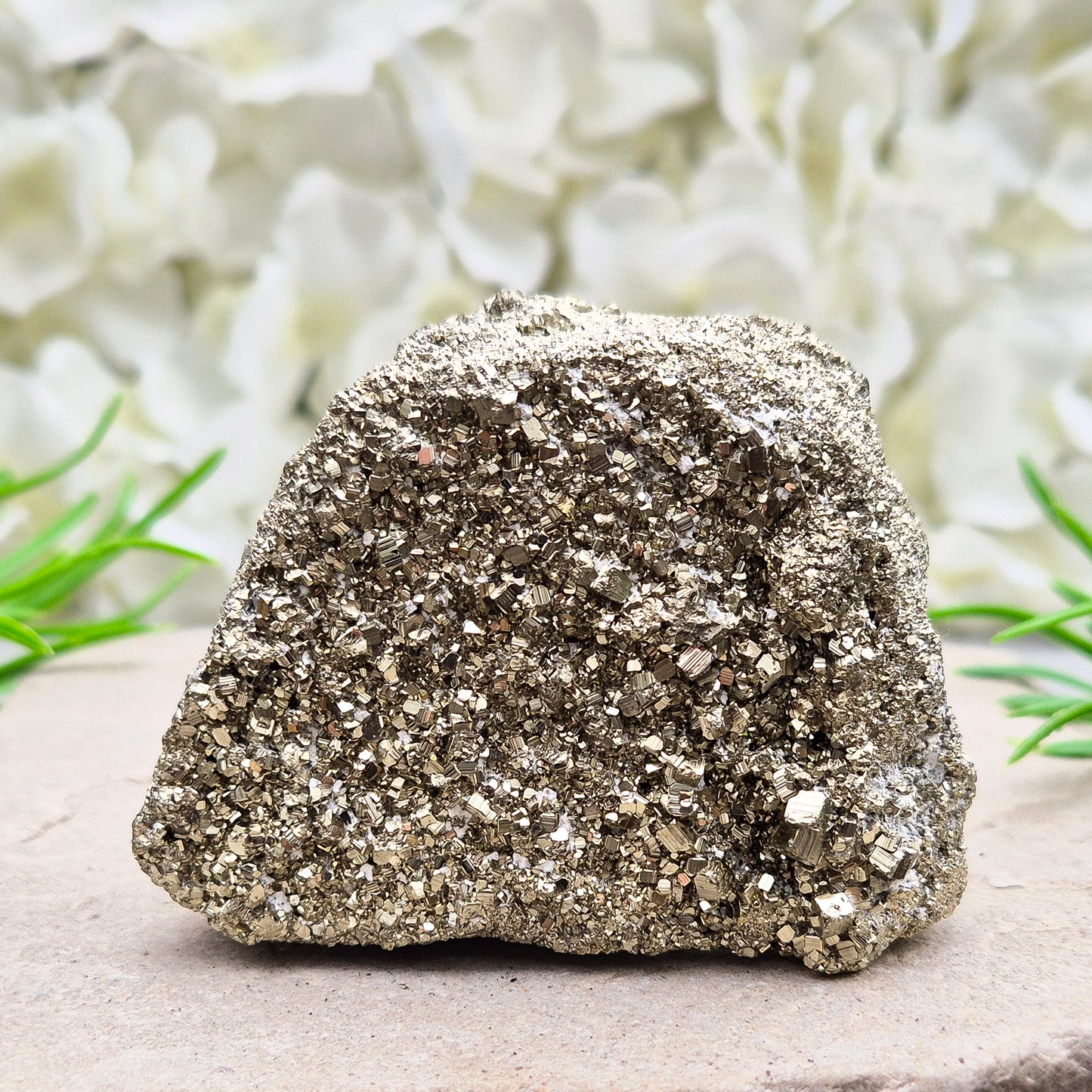 Peruvian pyrite cluster with natural cubic crystals and bright metallic shine. Sparkling druzy texture, ideal for display, grounding energy, or crystal collections.