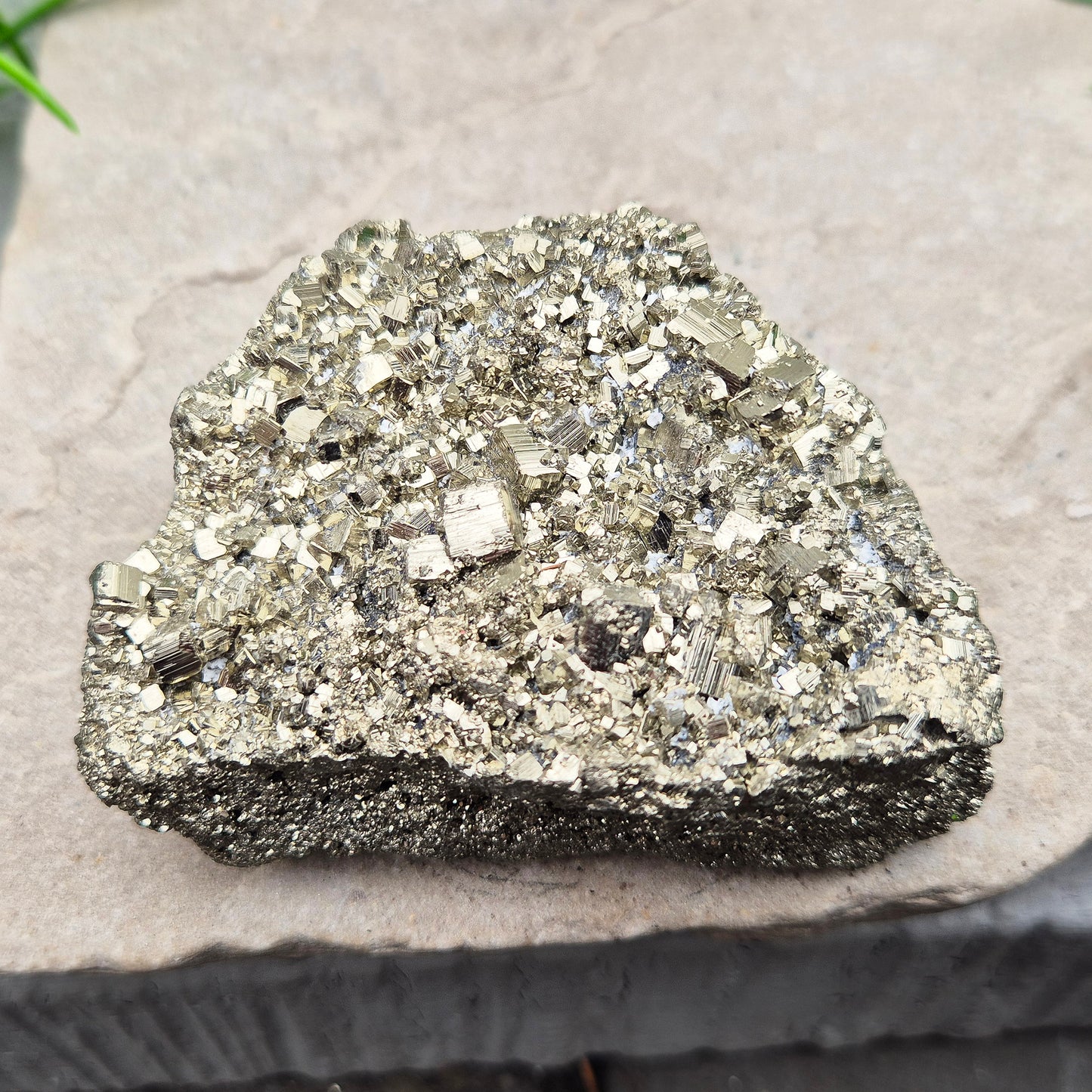 Peruvian pyrite cluster with natural cubic crystals and bright metallic shine. Sparkling druzy texture, ideal for display, grounding energy, or crystal collections.