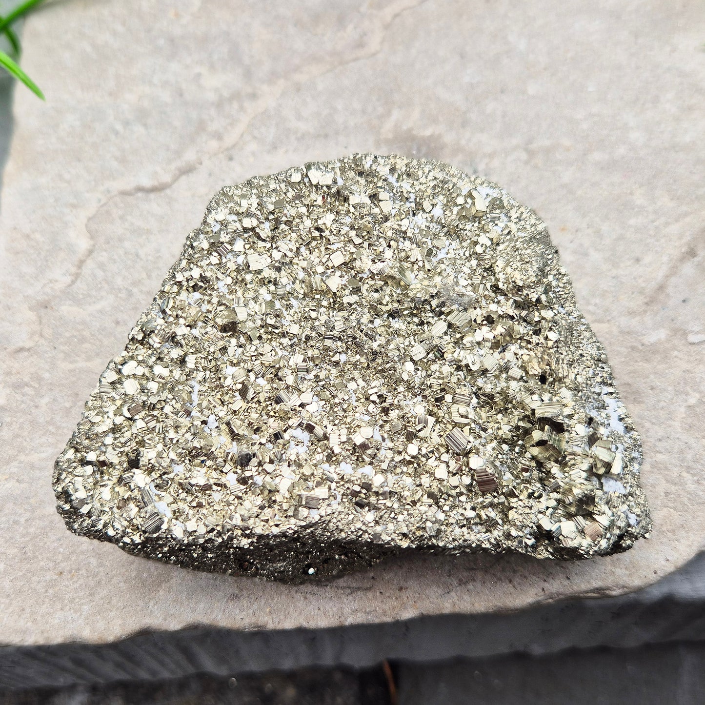 Peruvian pyrite cluster with natural cubic crystals and bright metallic shine. Sparkling druzy texture, ideal for display, grounding energy, or crystal collections.