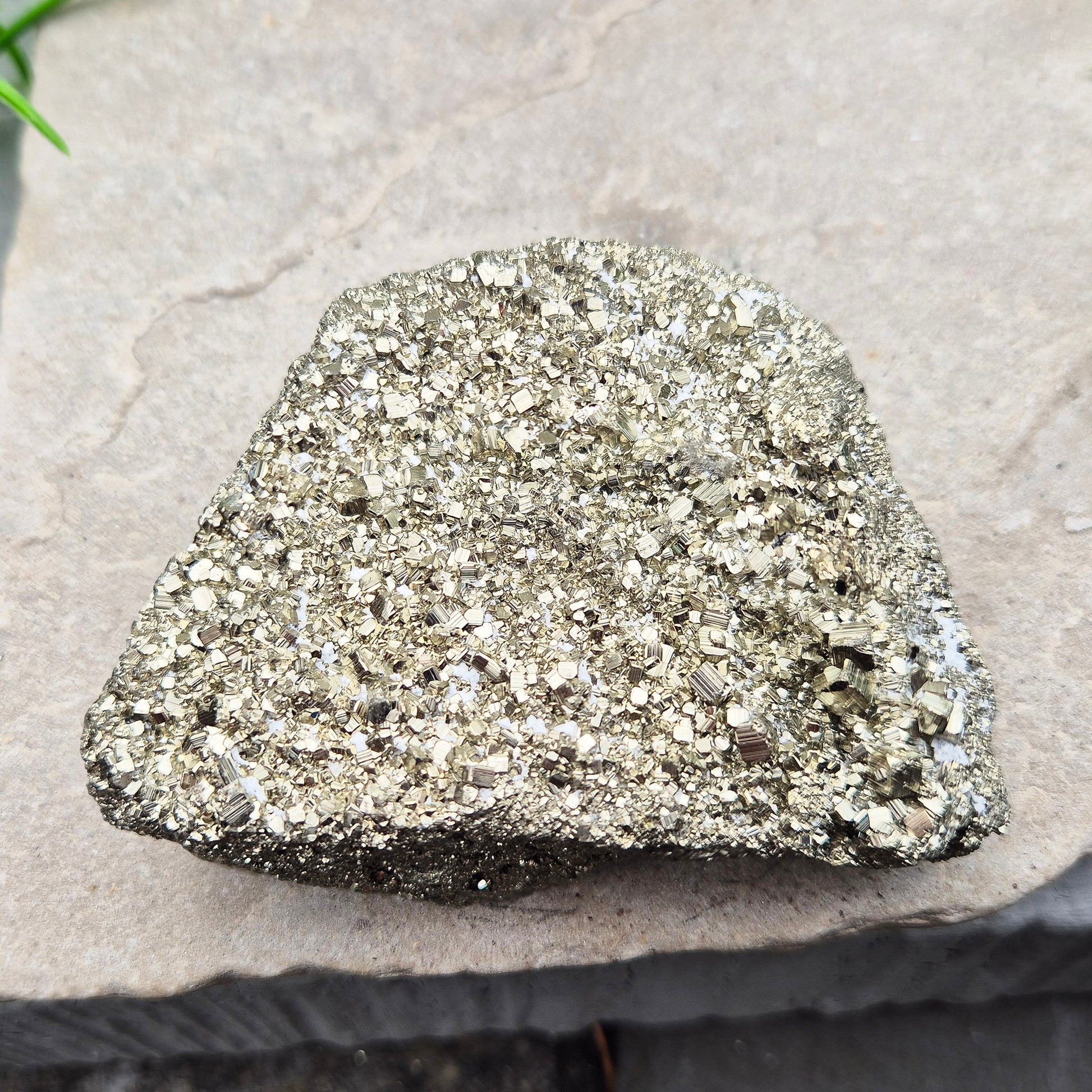 Peruvian pyrite cluster with natural cubic crystals and bright metallic shine. Sparkling druzy texture, ideal for display, grounding energy, or crystal collections.