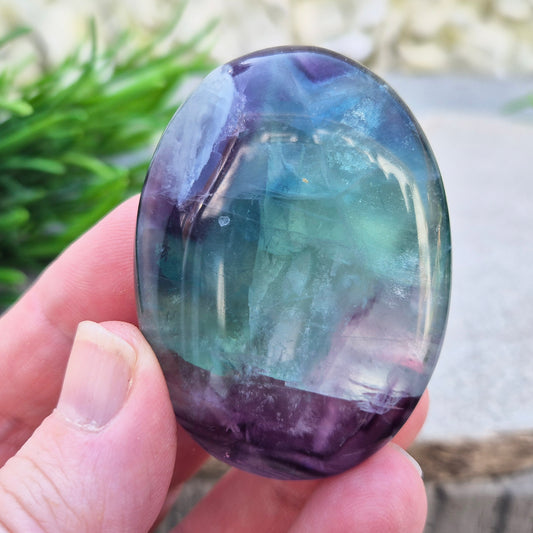 Fluorite palm stone in green, purple & blue. Supports focus, mental balance, and calm energy. Perfect for holding, meditation, or gifting.