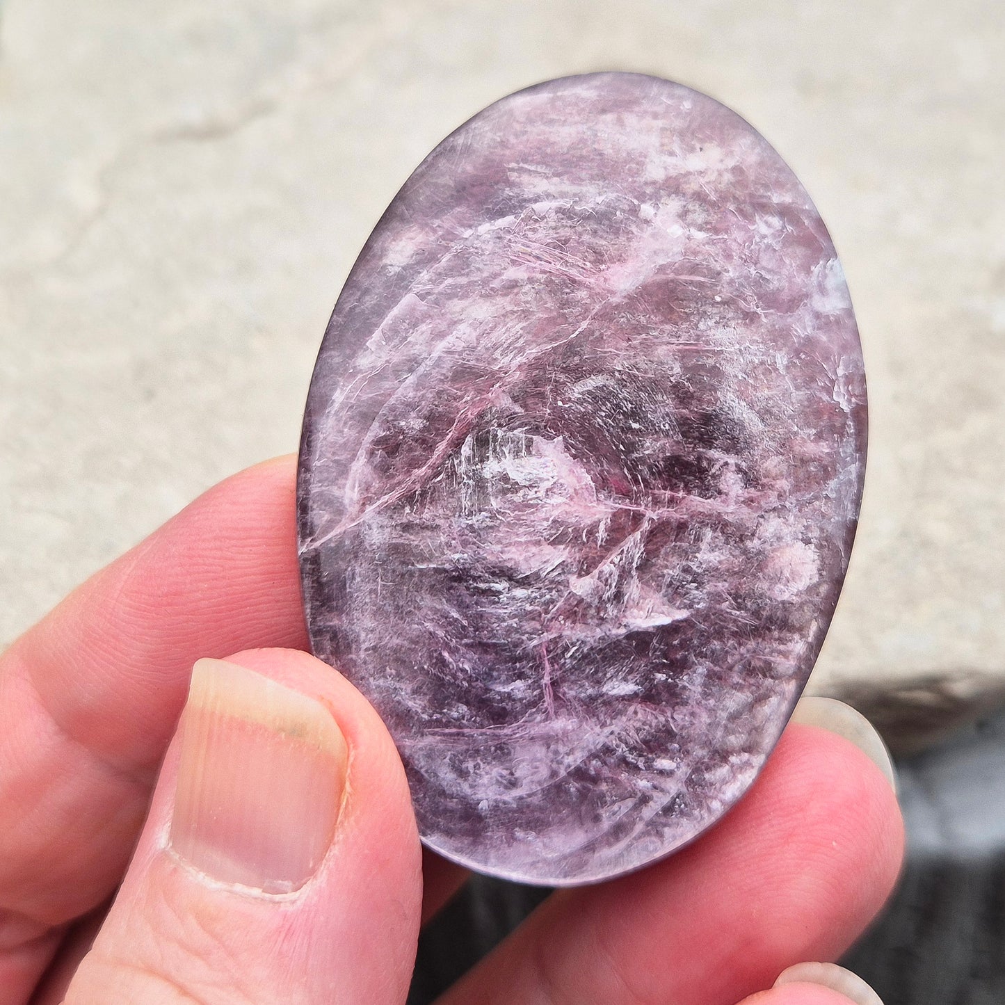 Metallic lilac Mica palm stone. Smooth, reflective, and grounding. Supports focus, calm emotions, and adds uplifting energy to any space.