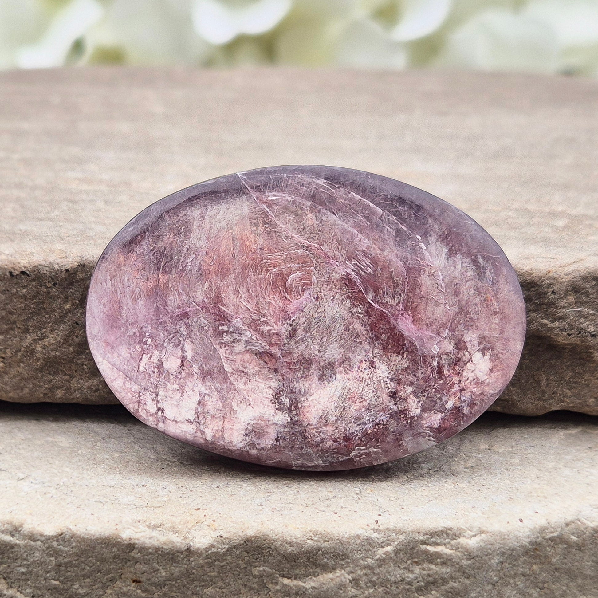 Metallic lilac Mica palm stone. Smooth, reflective, and grounding. Supports focus, calm emotions, and adds uplifting energy to any space.