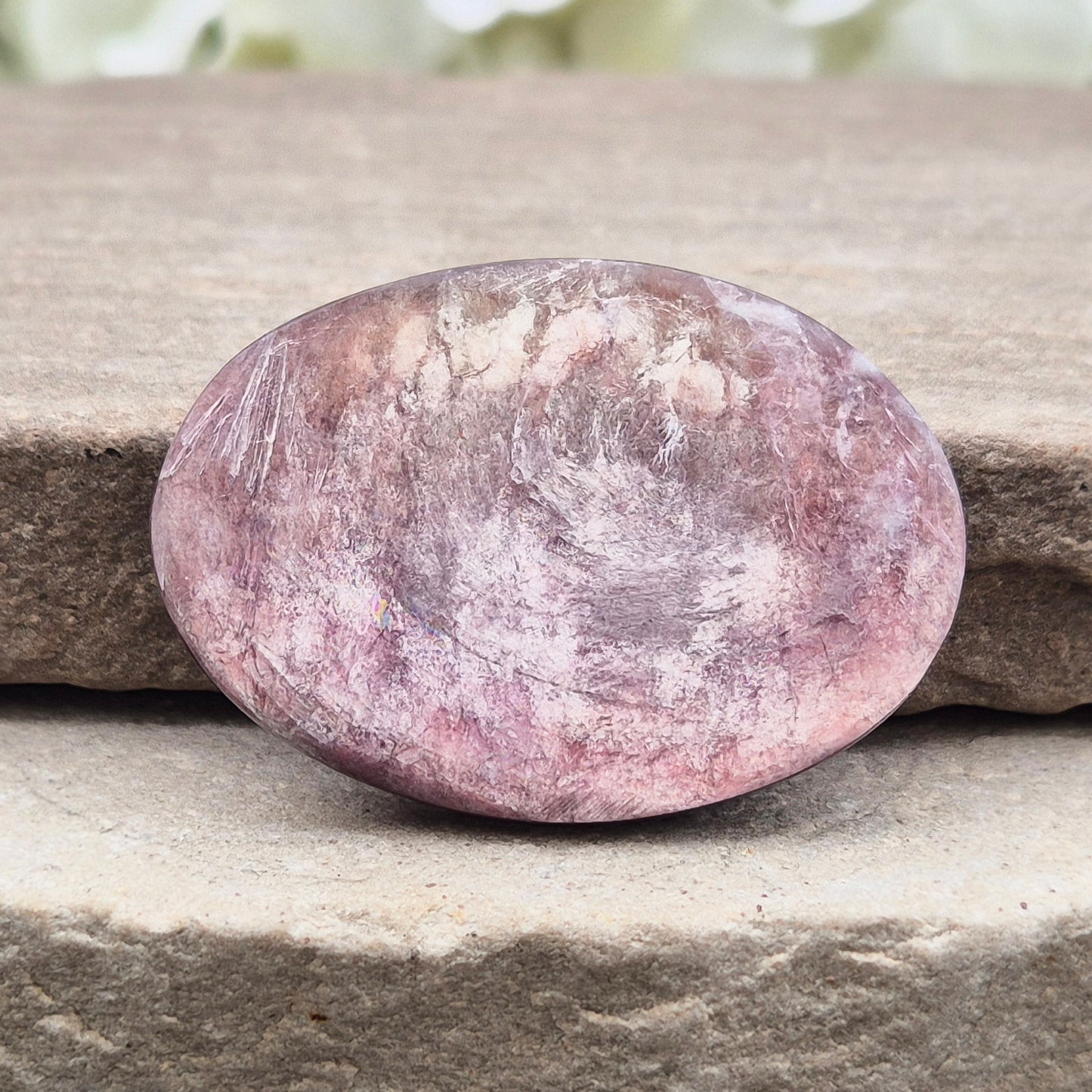 Metallic lilac Mica palm stone. Smooth, reflective, and grounding. Supports focus, calm emotions, and adds uplifting energy to any space.