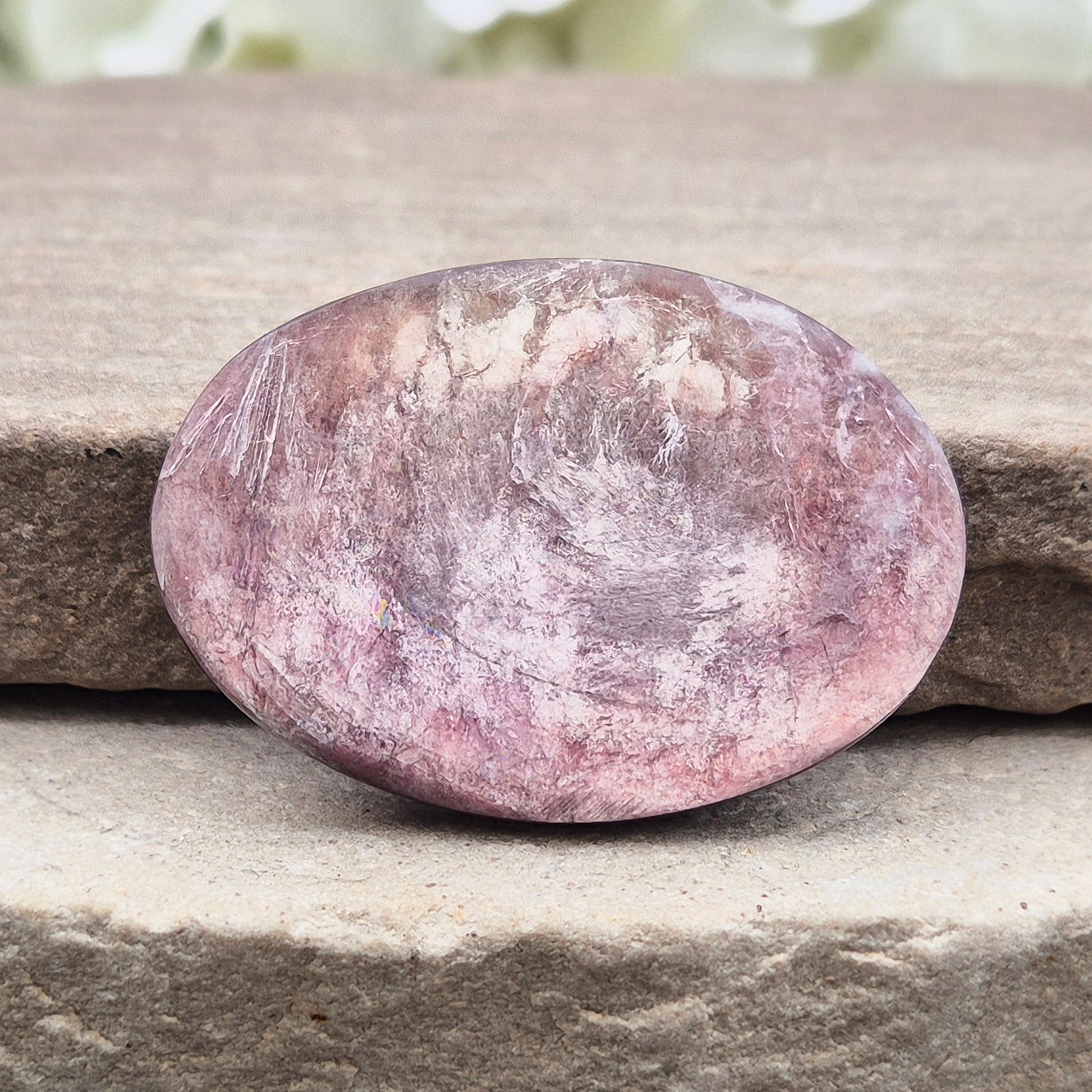 Metallic lilac Mica palm stone. Smooth, reflective, and grounding. Supports focus, calm emotions, and adds uplifting energy to any space.