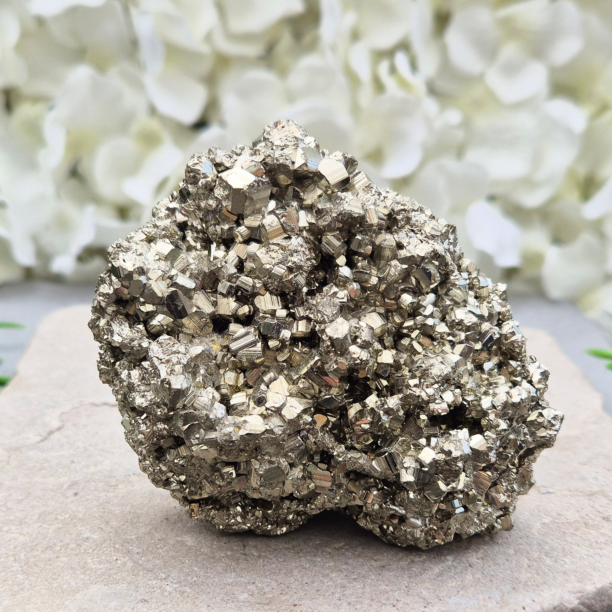 Natural pyrite crystal cluster from Peru featuring defined cubes & rich gold lustre. A striking, light-catching piece for home decor, desks, or crystal lovers.