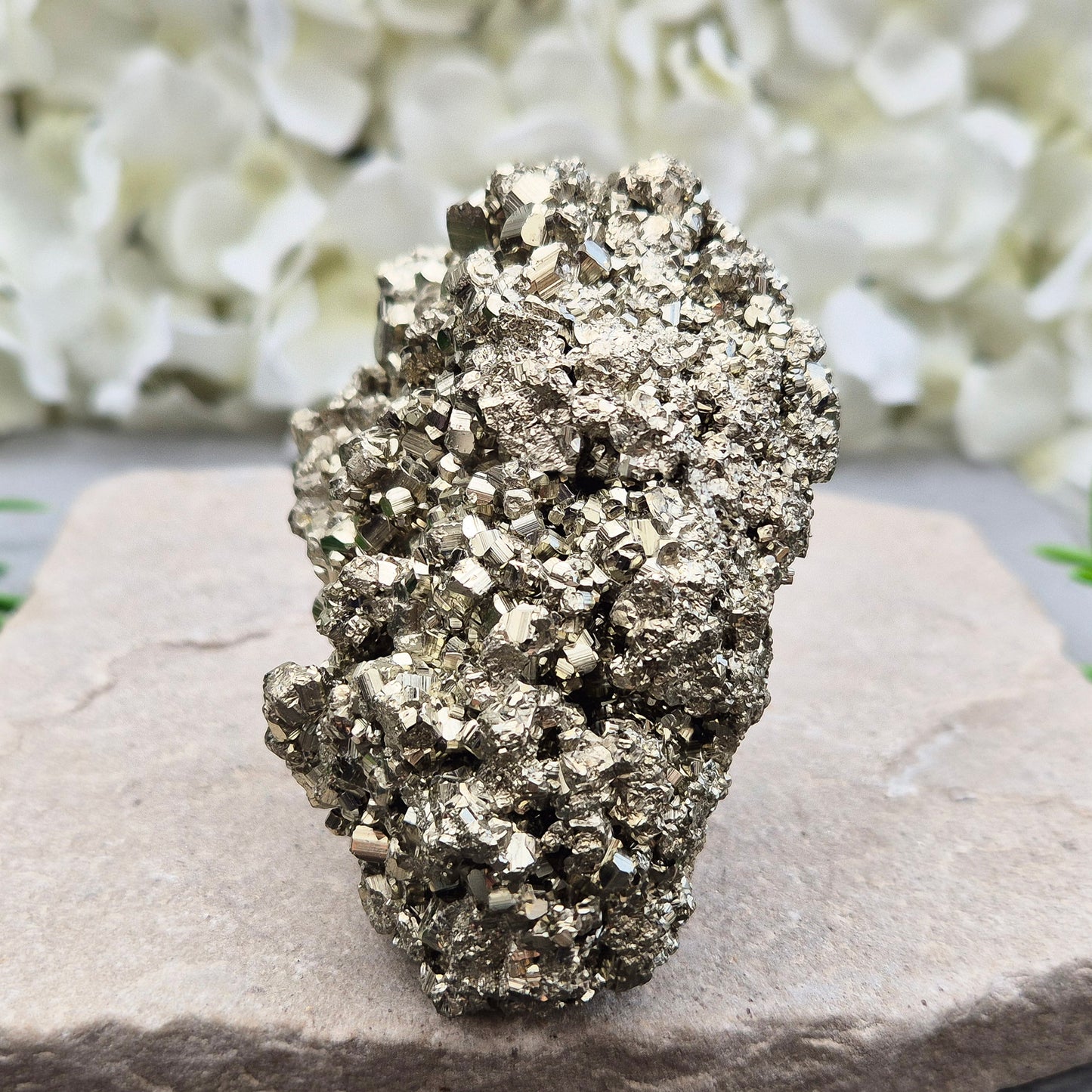 Natural pyrite crystal cluster from Peru featuring defined cubes & rich gold lustre. A striking, light-catching piece for home decor, desks, or crystal lovers.