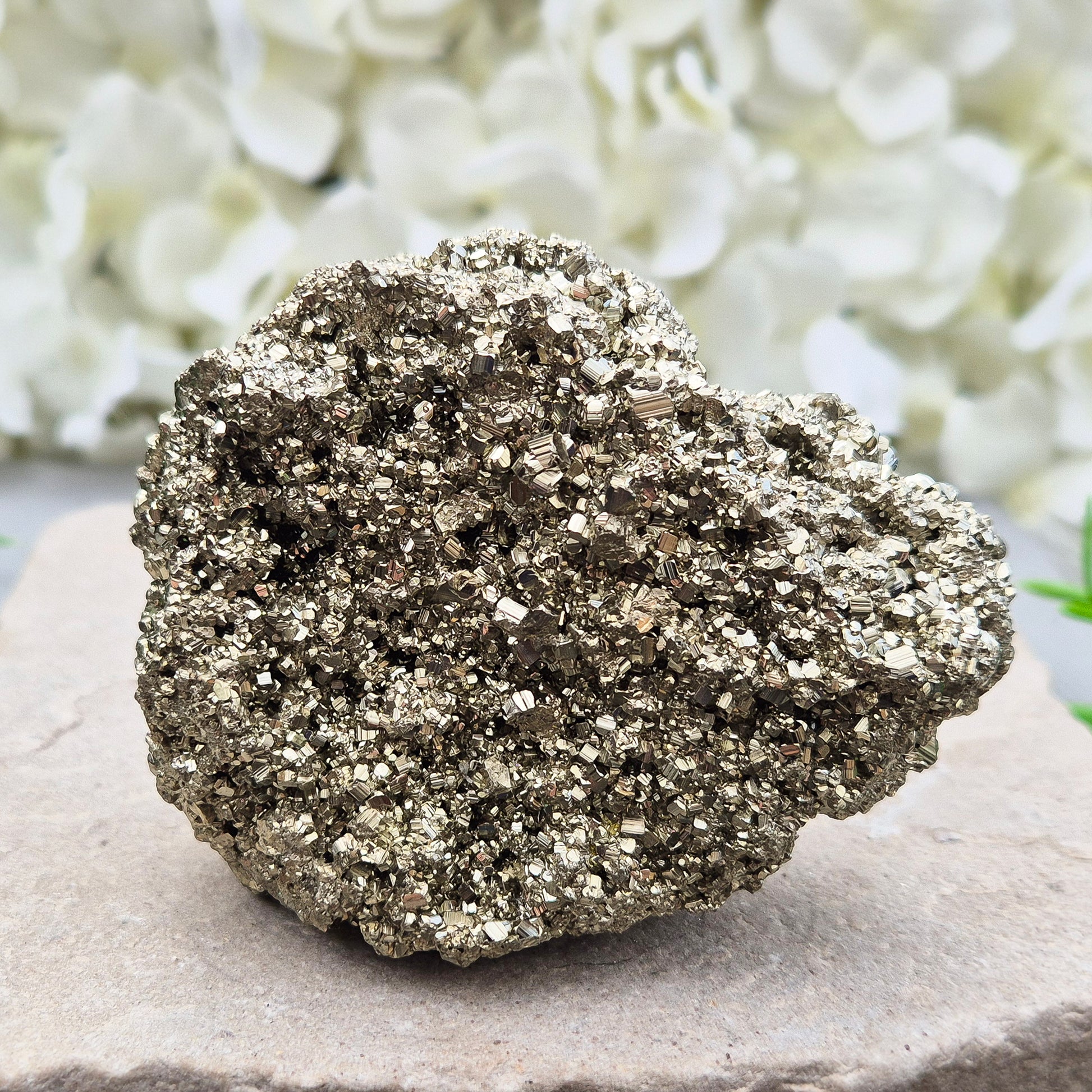 Natural pyrite crystal cluster from Peru featuring defined cubes & rich gold lustre. A striking, light-catching piece for home decor, desks, or crystal lovers.