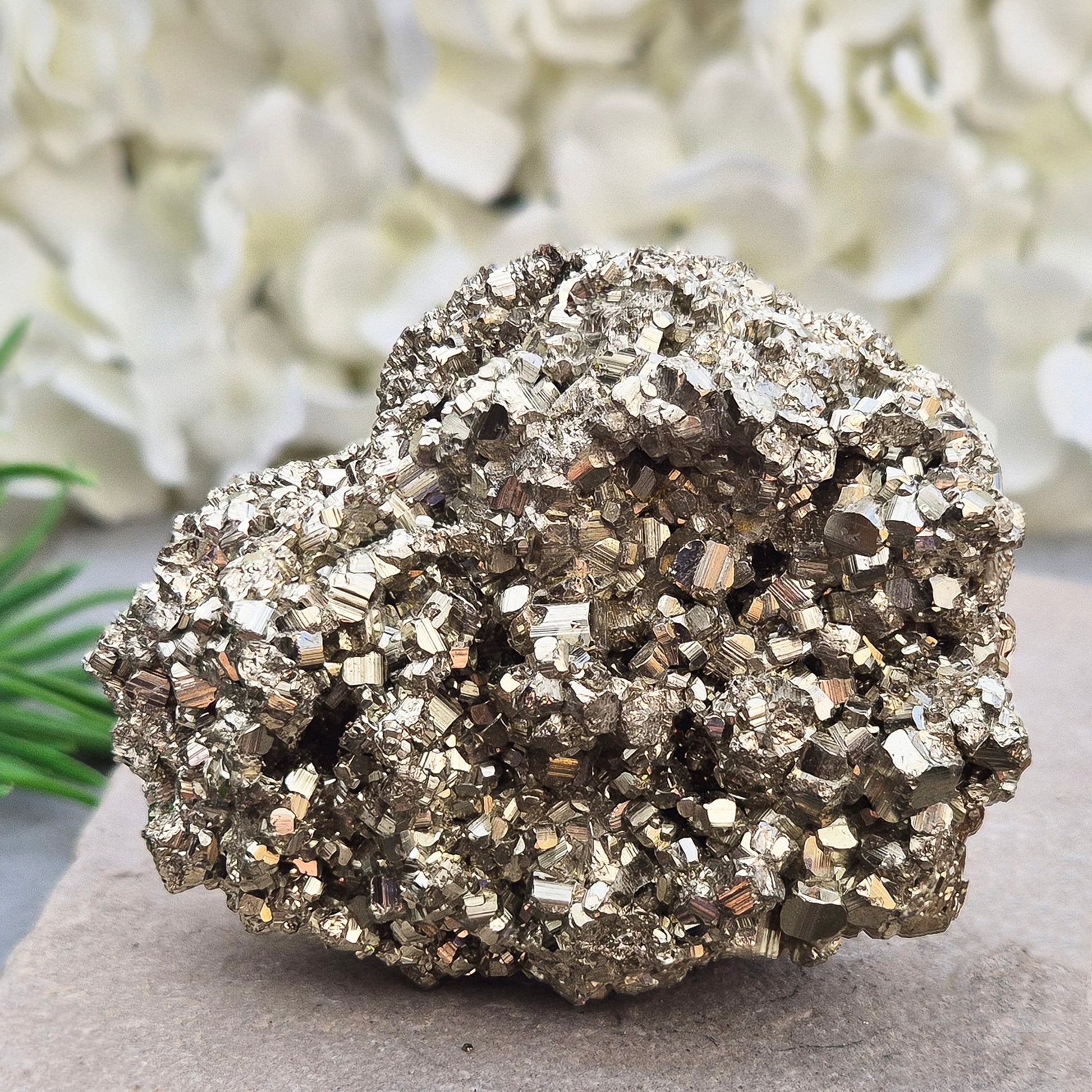 Natural pyrite crystal cluster from Peru featuring defined cubes & rich gold lustre. A striking, light-catching piece for home decor, desks, or crystal lovers.
