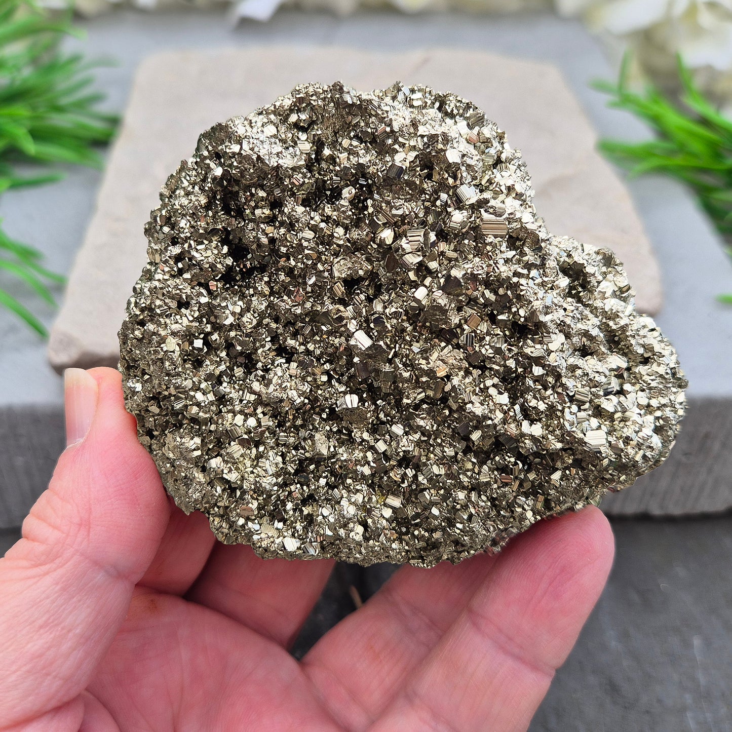 Natural pyrite crystal cluster from Peru featuring defined cubes & rich gold lustre. A striking, light-catching piece for home decor, desks, or crystal lovers.