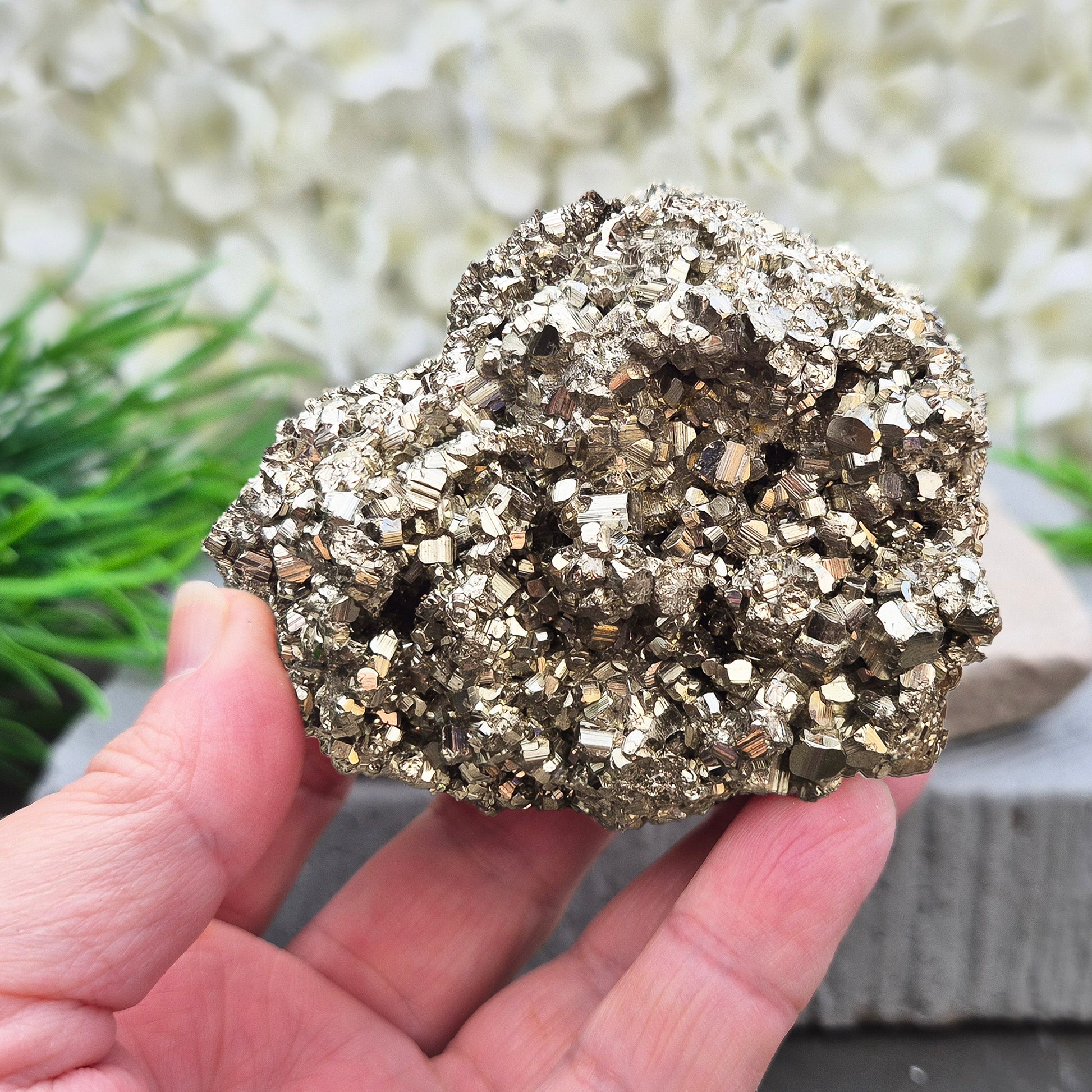 Natural pyrite crystal cluster from Peru featuring defined cubes & rich gold lustre. A striking, light-catching piece for home decor, desks, or crystal lovers.