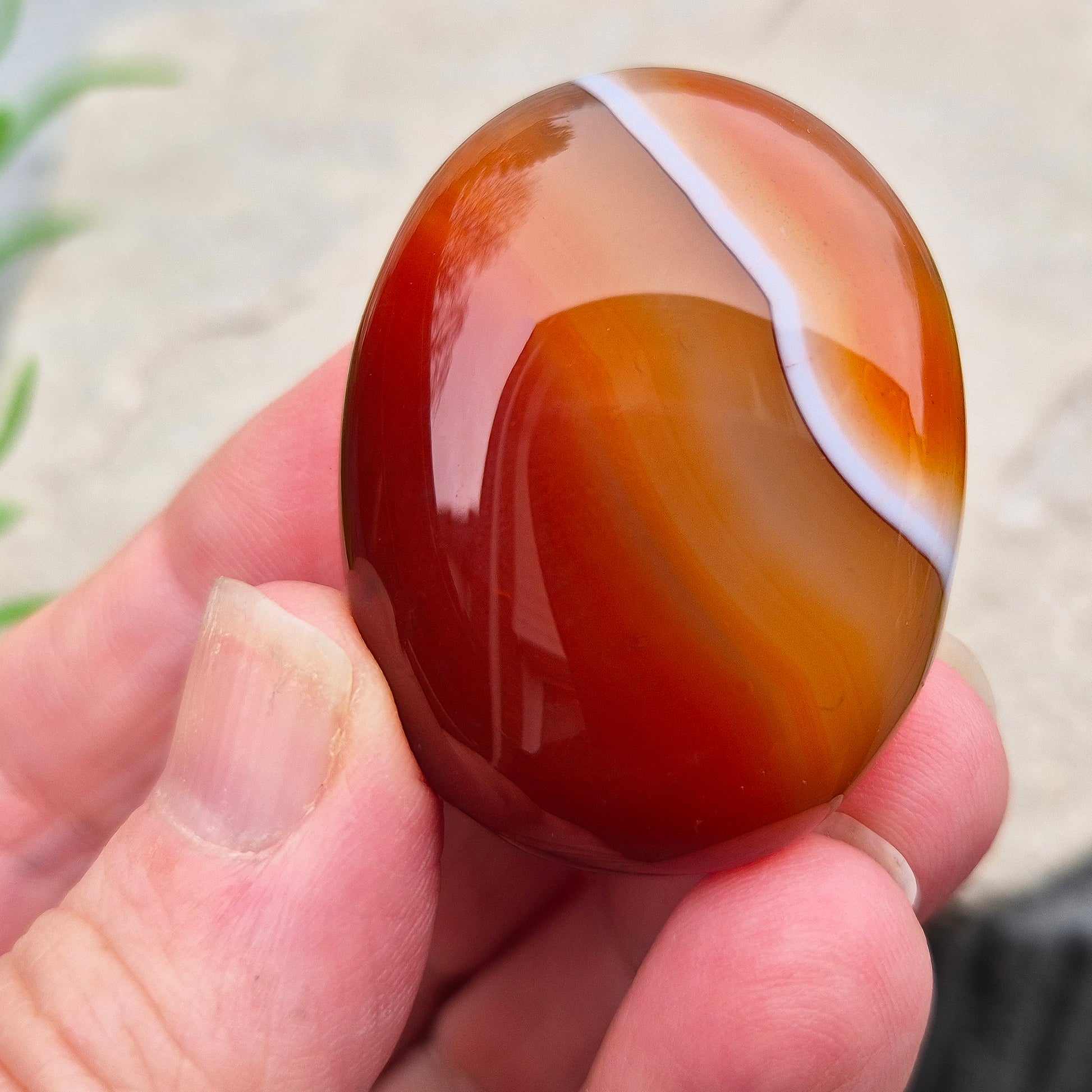 Banded Carnelian palm stone from Madagascar. Boosts motivation, confidence and creativity. Grounding Root and Sacral crystal for energy and focus. 