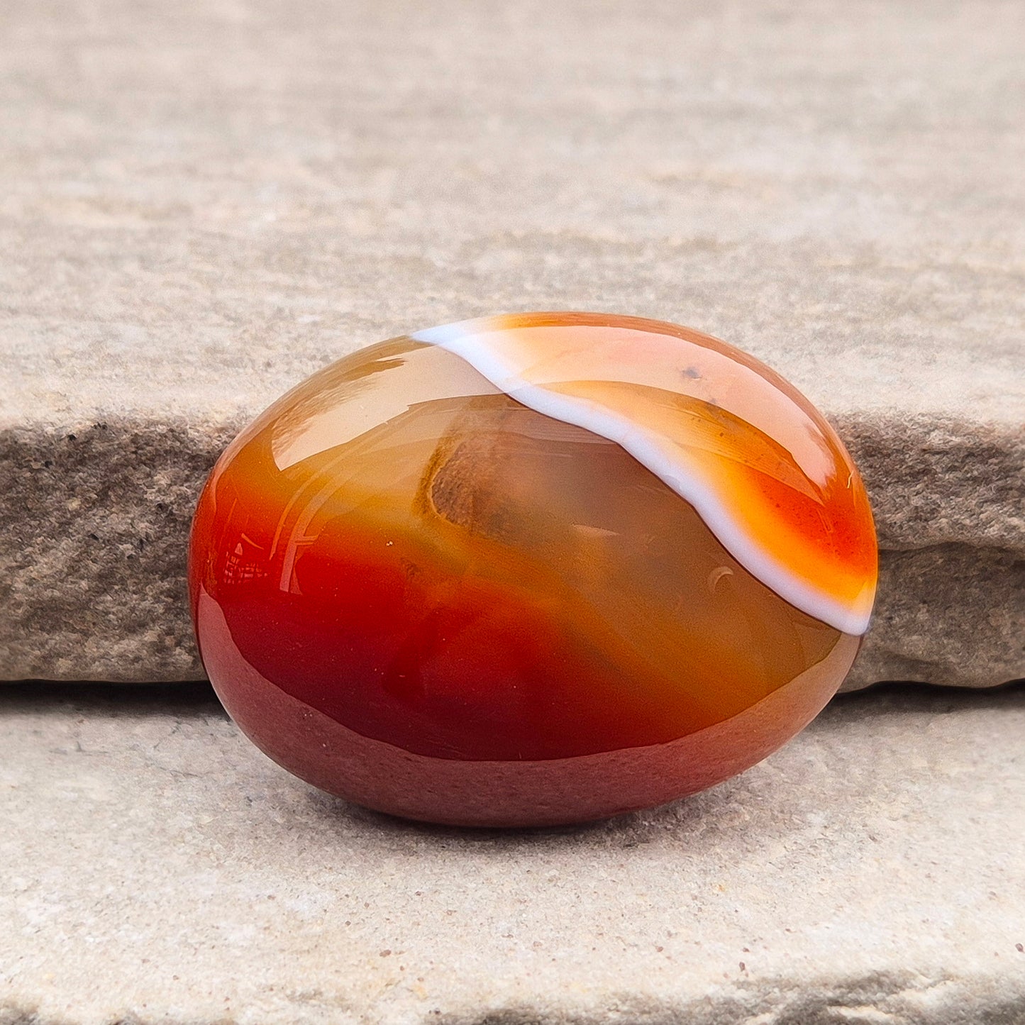 Banded Carnelian palm stone from Madagascar. Boosts motivation, confidence and creativity. Grounding Root and Sacral crystal for energy and focus. 