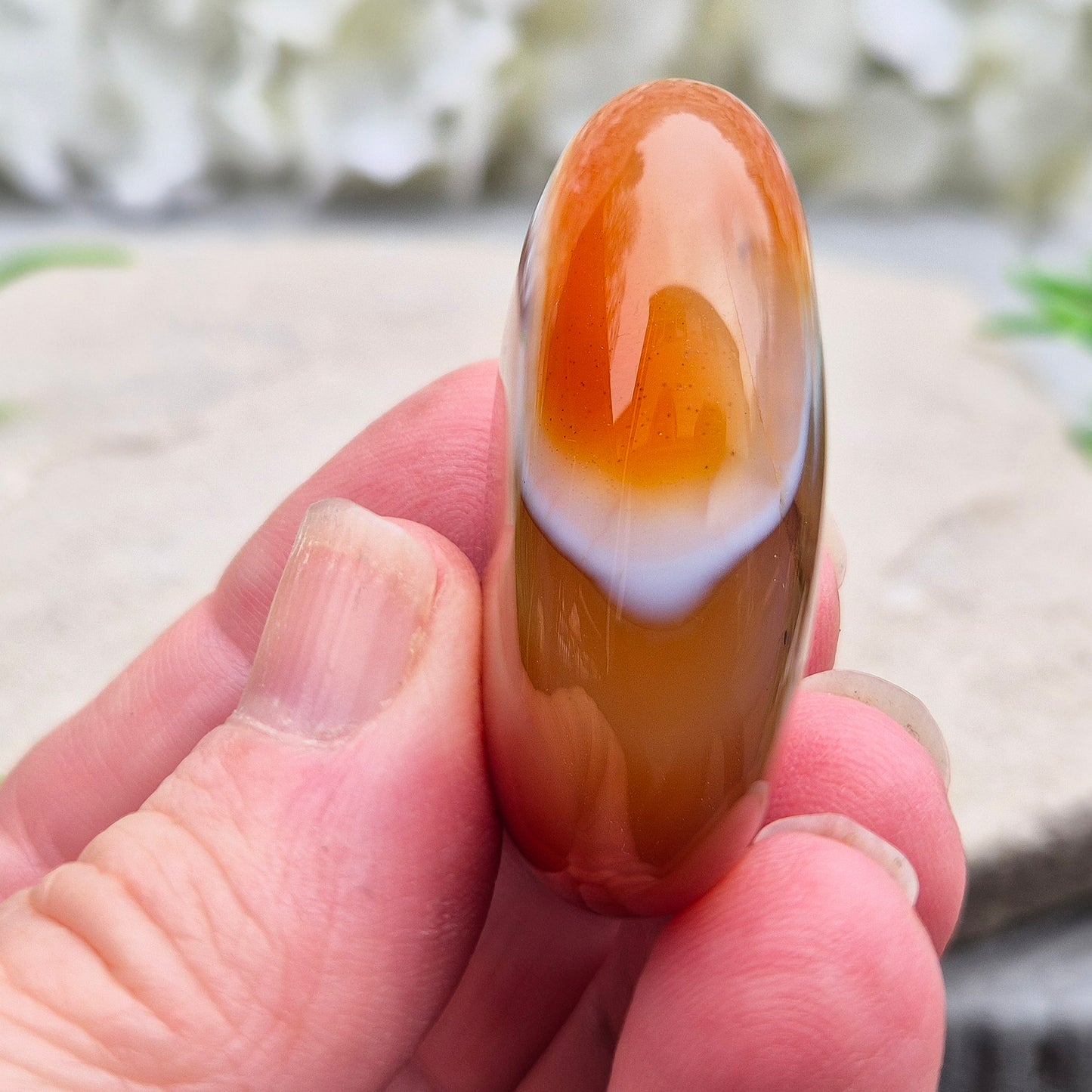 Banded Carnelian palm stone from Madagascar. Boosts motivation, confidence and creativity. Grounding Root and Sacral crystal for energy and focus. 