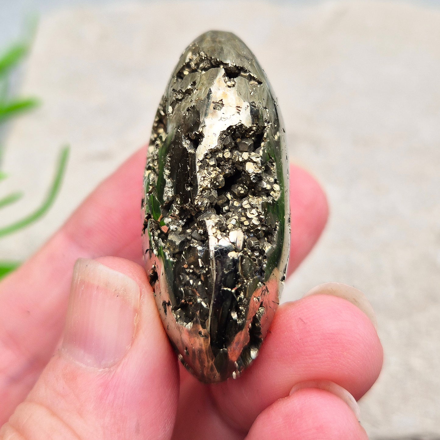 Pyrite palm stone with natural metallic shine, perfect for boosting confidence, focus, and motivation. A solid, grounding piece to keep close for daily energy support.
