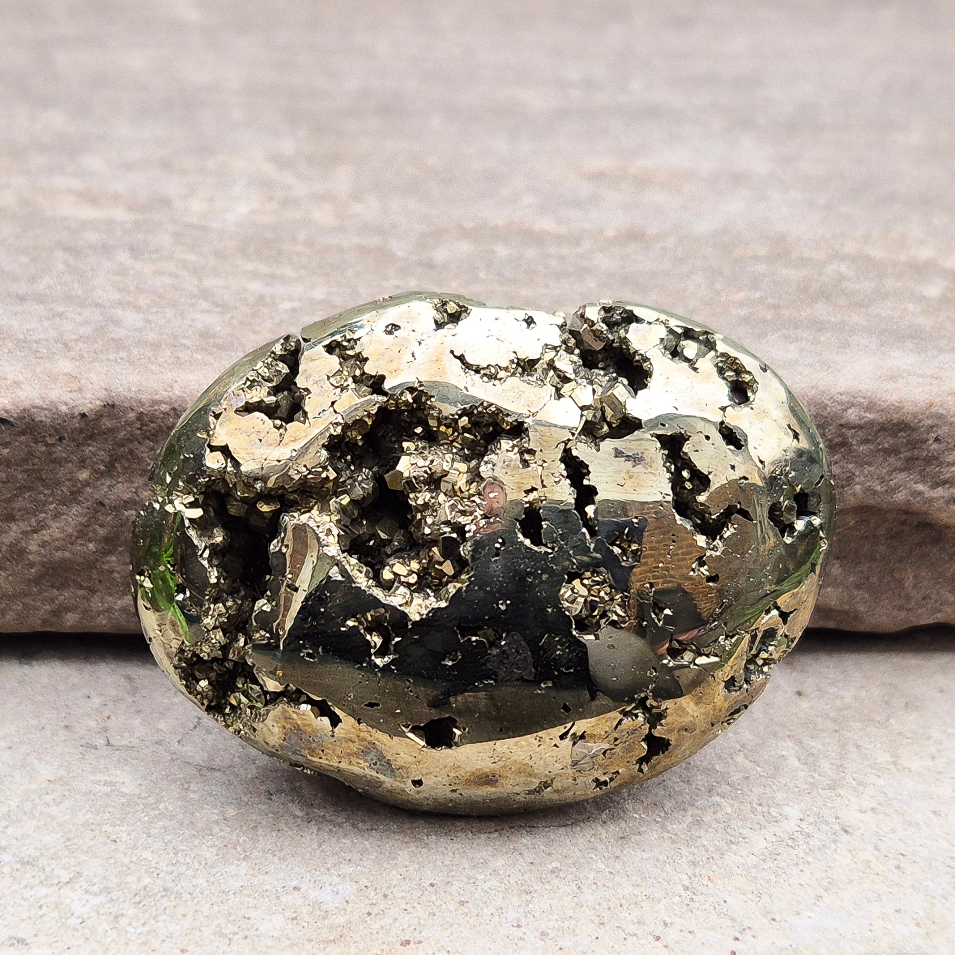 Pyrite palm stone with natural metallic shine, perfect for boosting confidence, focus, and motivation. A solid, grounding piece to keep close for daily energy support.