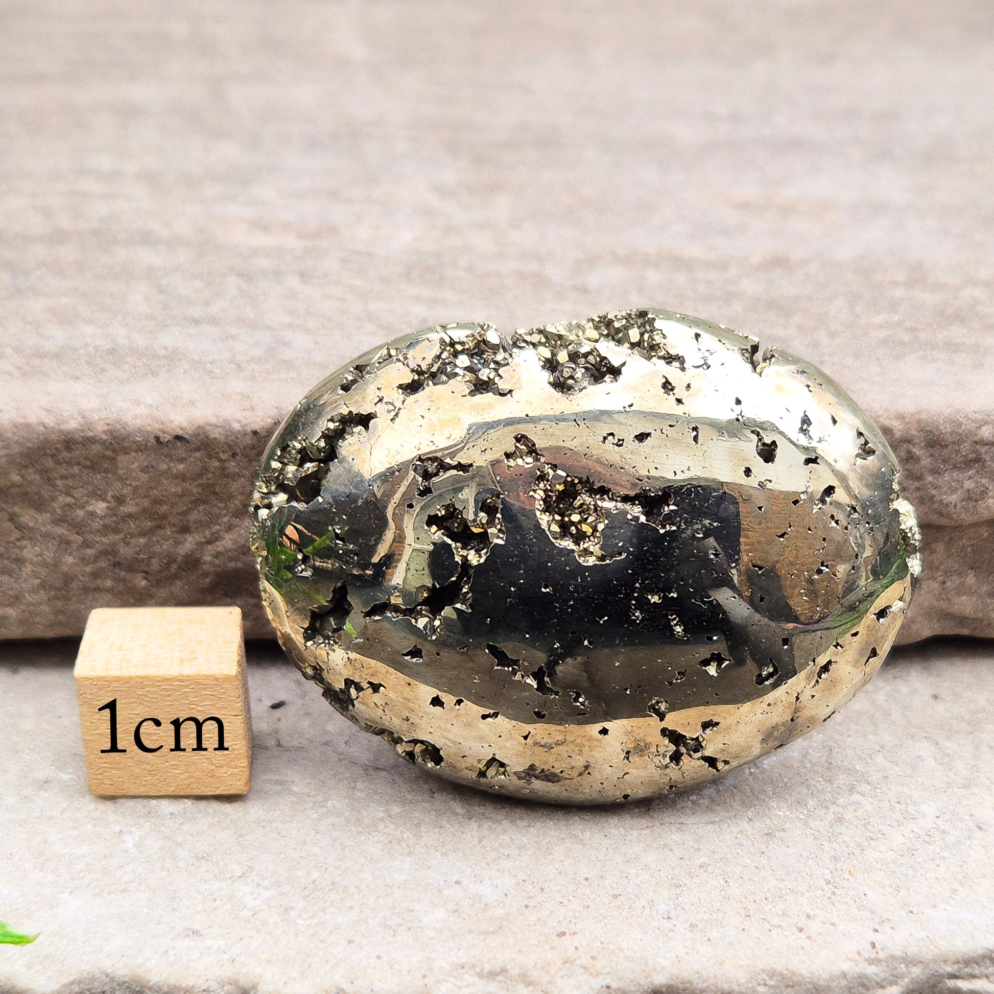 Pyrite palm stone with natural metallic shine, perfect for boosting confidence, focus, and motivation. A solid, grounding piece to keep close for daily energy support.