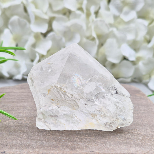 Quartz Crystal Standing Point. Point is polished at tip with a rainbow, sides are natural and the base is cut flat so it will sit on an even surface.