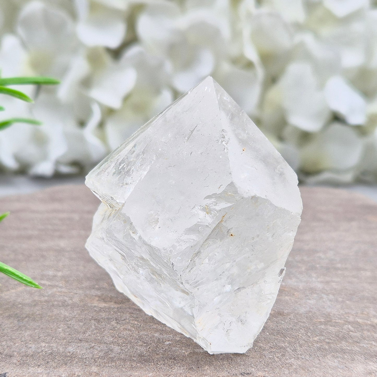 Quartz Crystal Standing Point. Point is polished at tip with a rainbow, sides are natural and the base is cut flat so it will sit on an even surface.