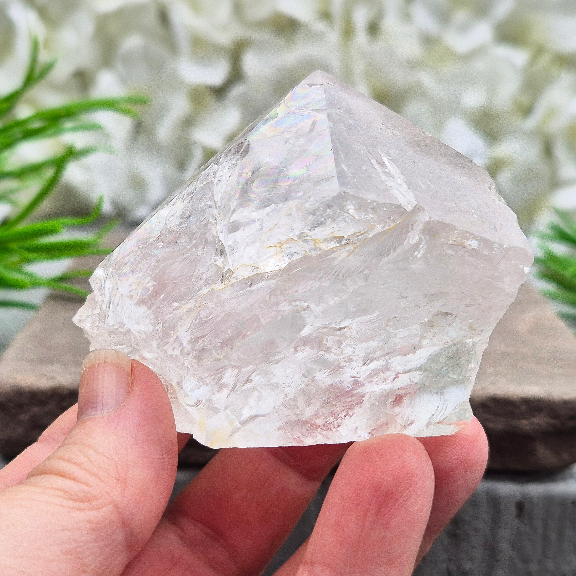 Quartz Crystal Standing Point. Point is polished at tip with a rainbow, sides are natural and the base is cut flat so it will sit on an even surface.