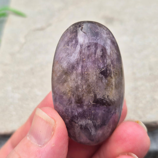 Ametrine polished palm stone with soft purple and golden tones. A natural blend of Amethyst and Citrine with a balanced, easy feel.