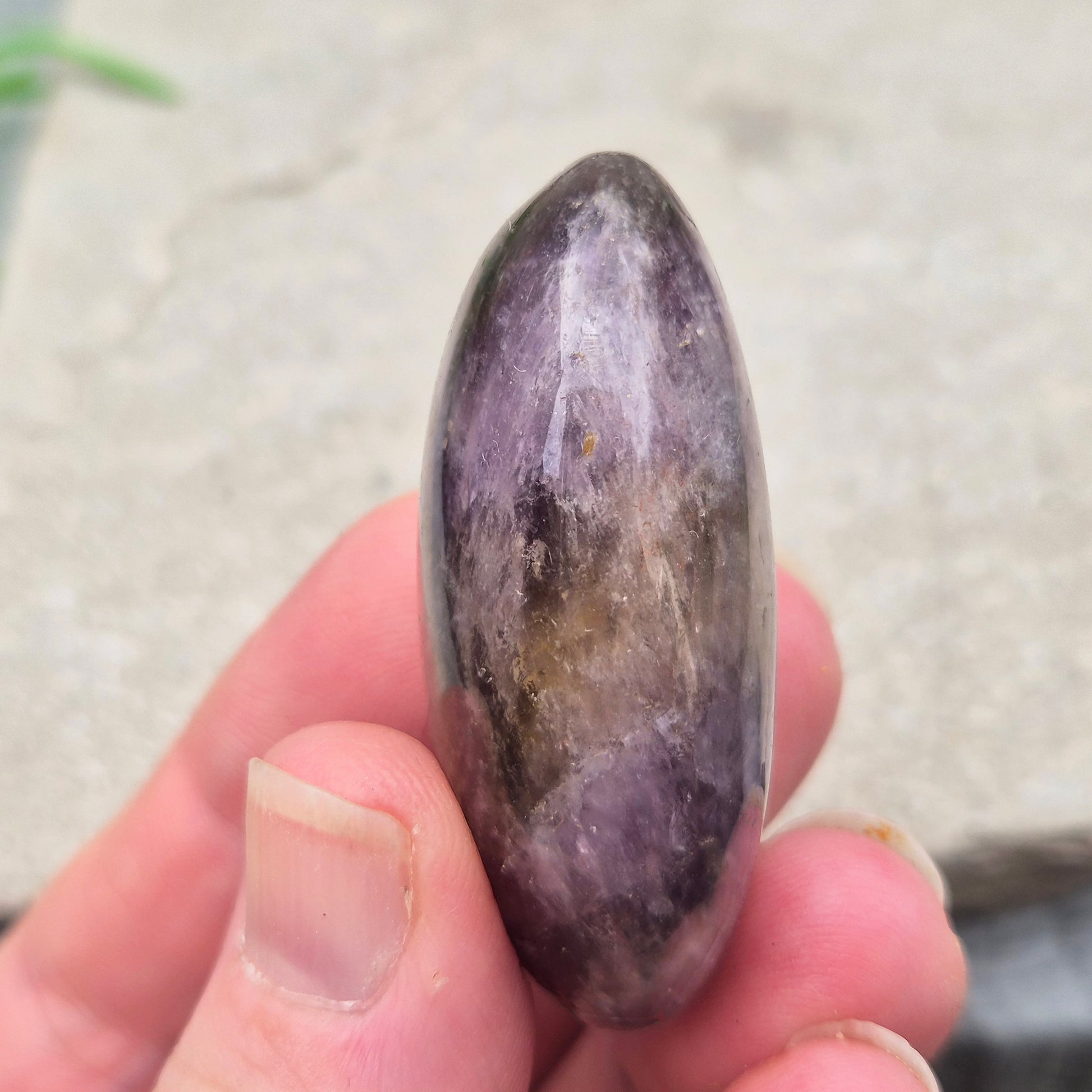 Ametrine polished palm stone with soft purple and golden tones. A natural blend of Amethyst and Citrine with a balanced, easy feel.