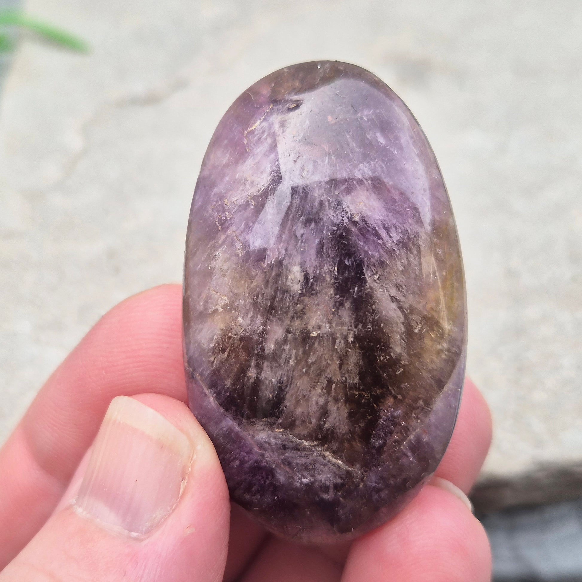 Ametrine polished palm stone with soft purple and golden tones. A natural blend of Amethyst and Citrine with a balanced, easy feel.