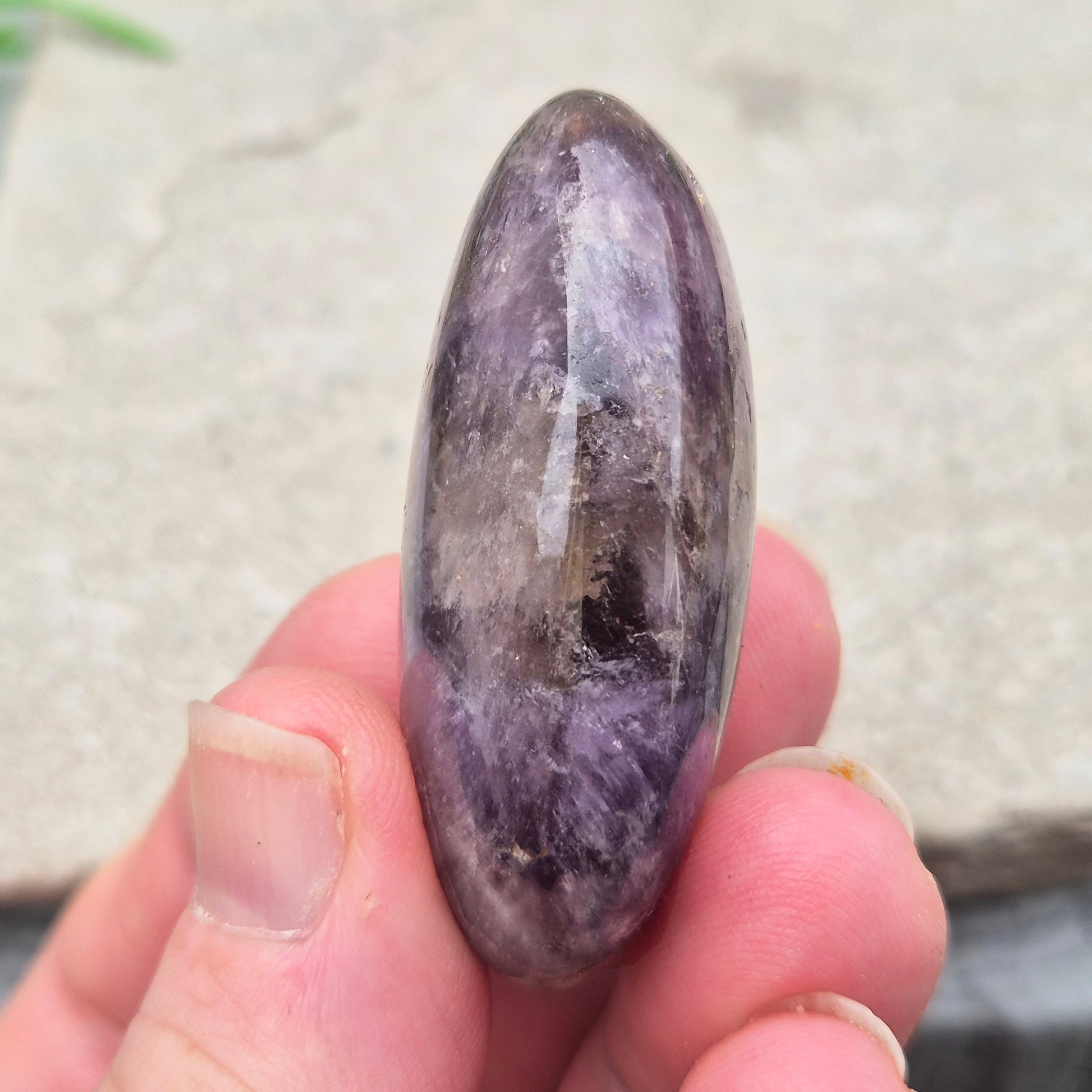 Ametrine polished palm stone with soft purple and golden tones. A natural blend of Amethyst and Citrine with a balanced, easy feel.