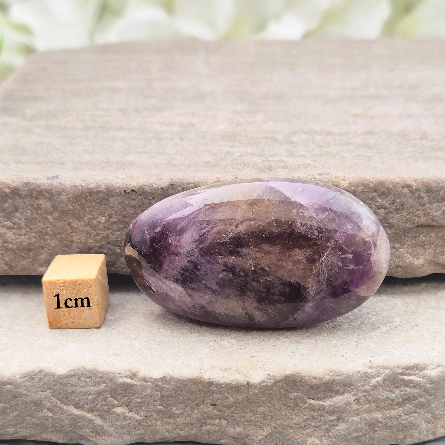 Ametrine polished palm stone with soft purple and golden tones. A natural blend of Amethyst and Citrine with a balanced, easy feel.